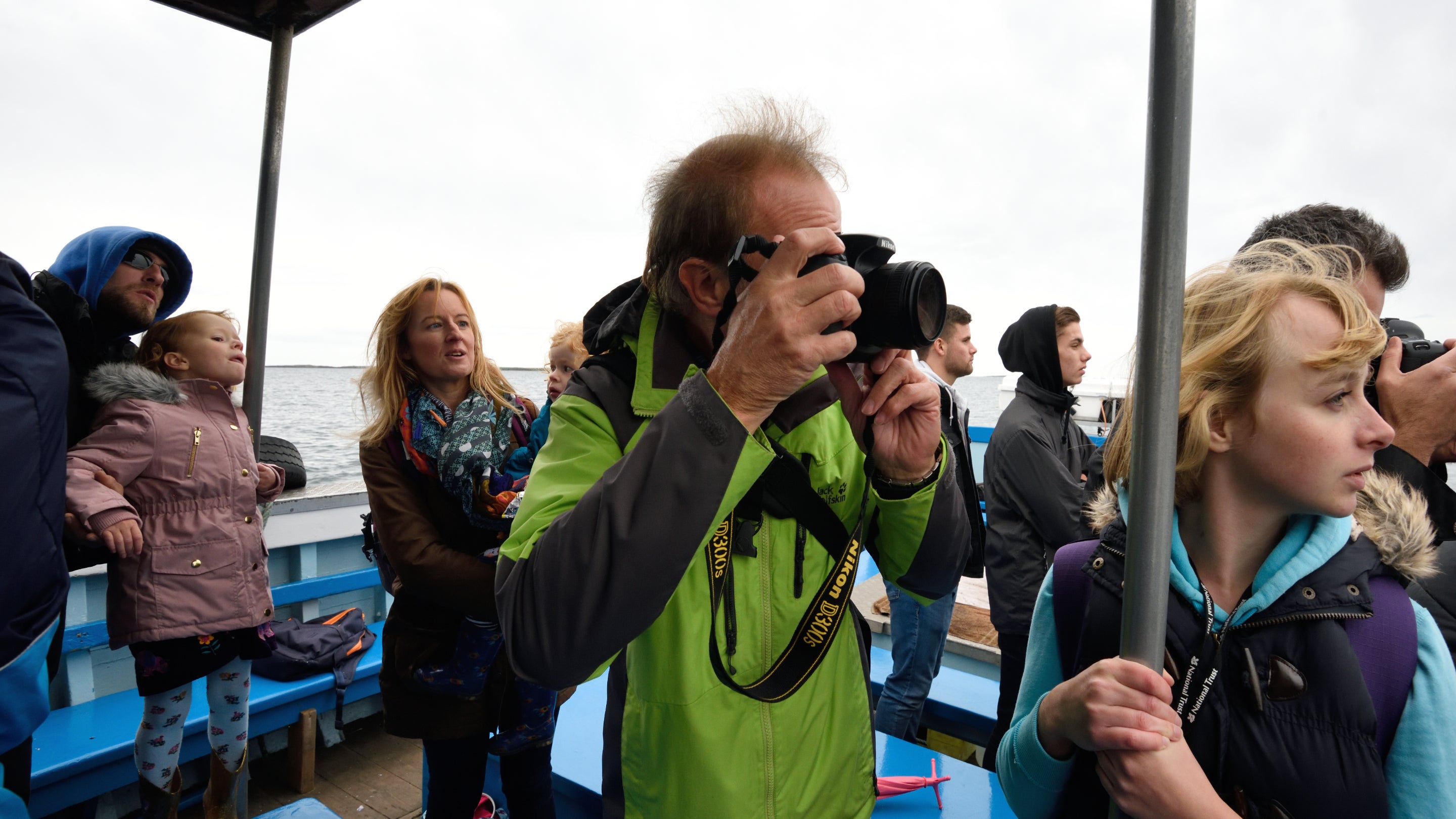 A family on a boat sailing to the Farne Islands