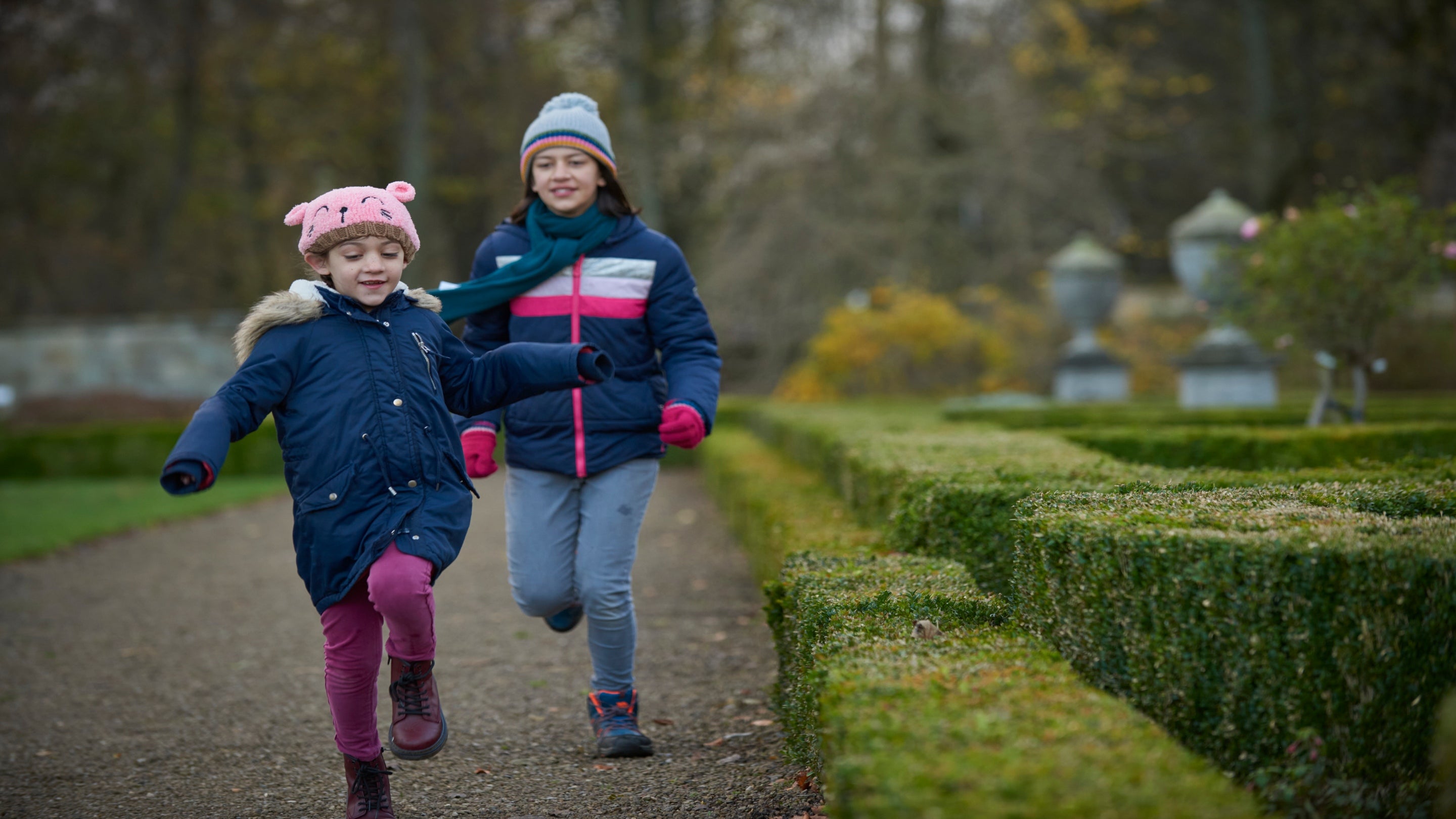 Children running in the garden at Seaton Delaval Hall, Northumberland