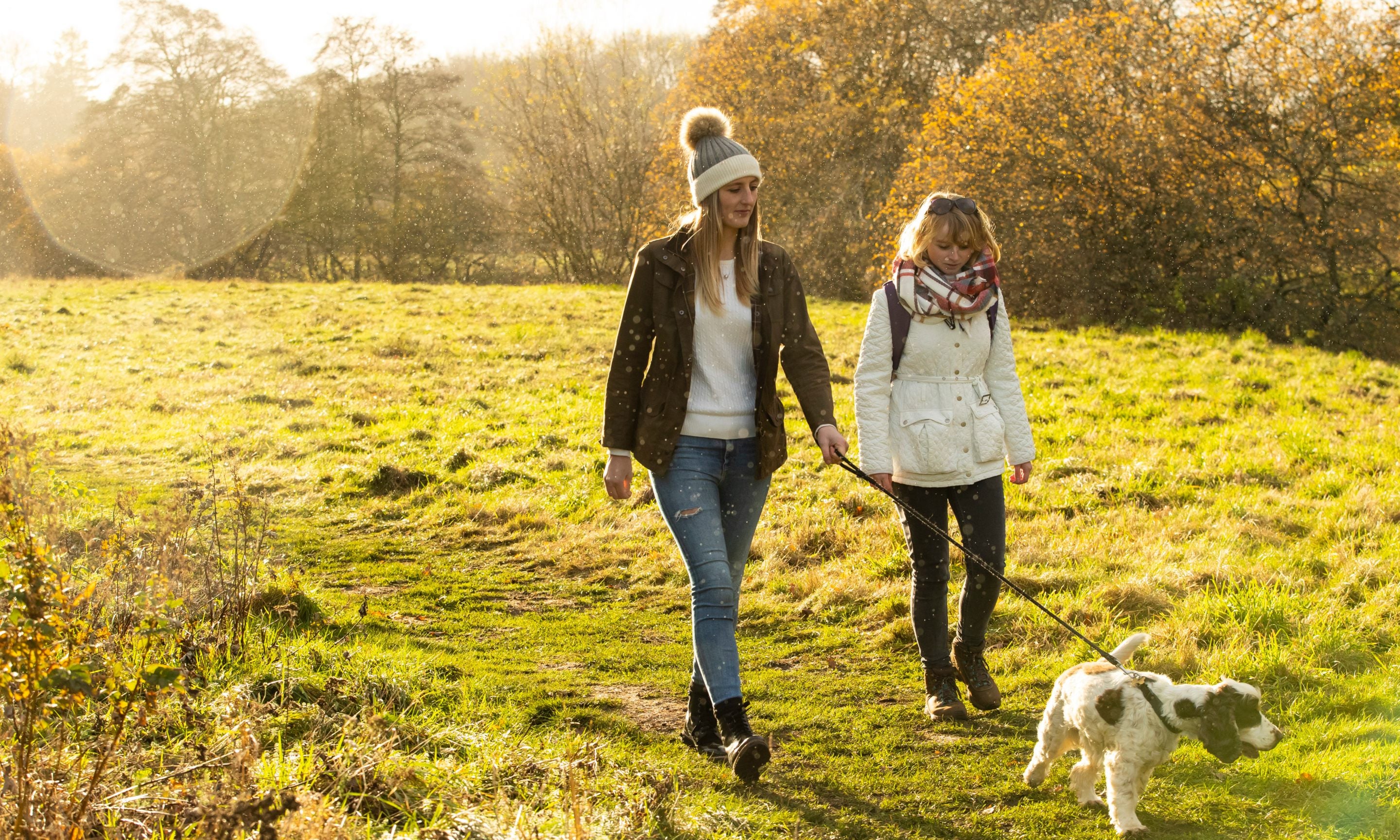 Family visitors enjoying an autumnal walk on the estate at Wallington, Northumberland