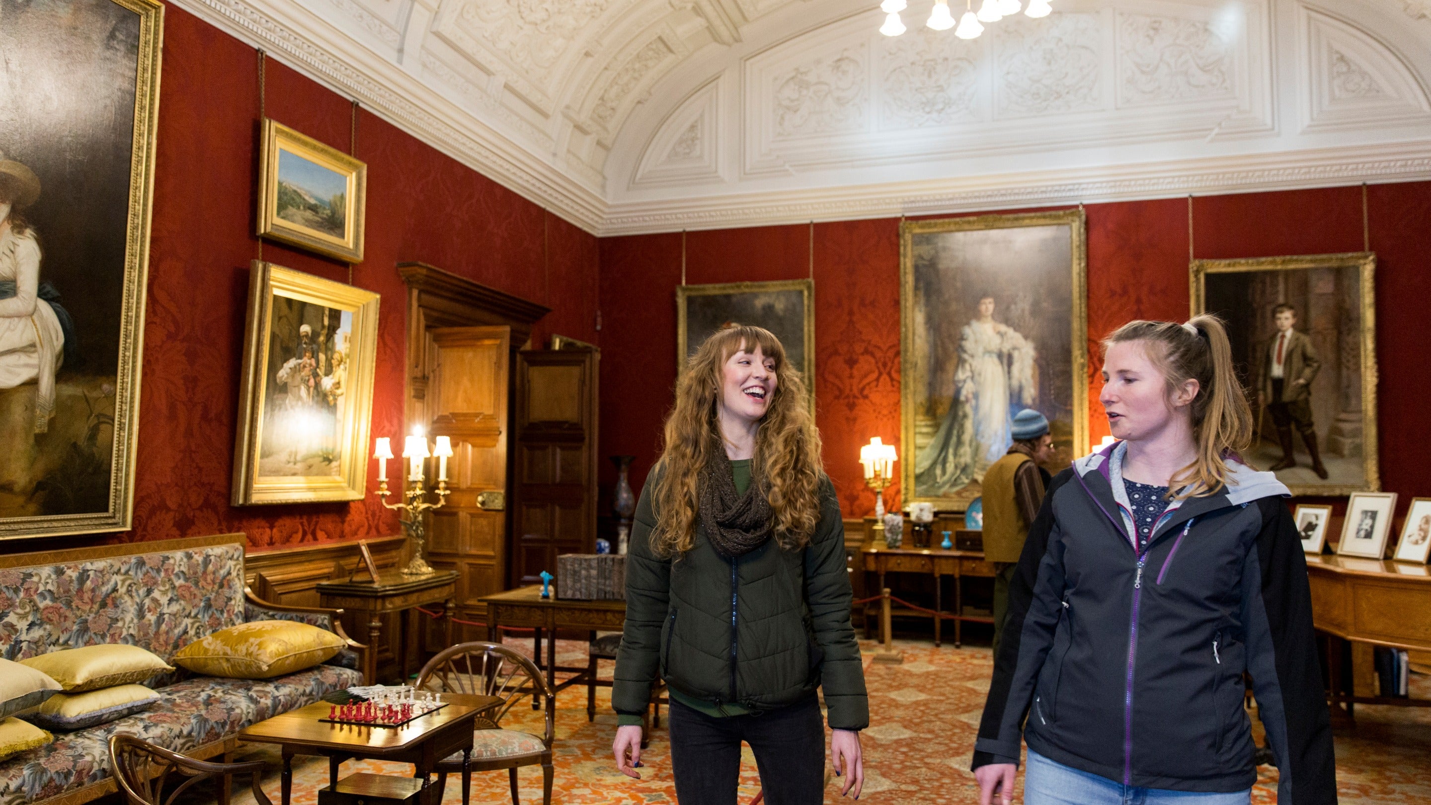 Visitors exploring the Drawing Room at Cragside, Northumberland