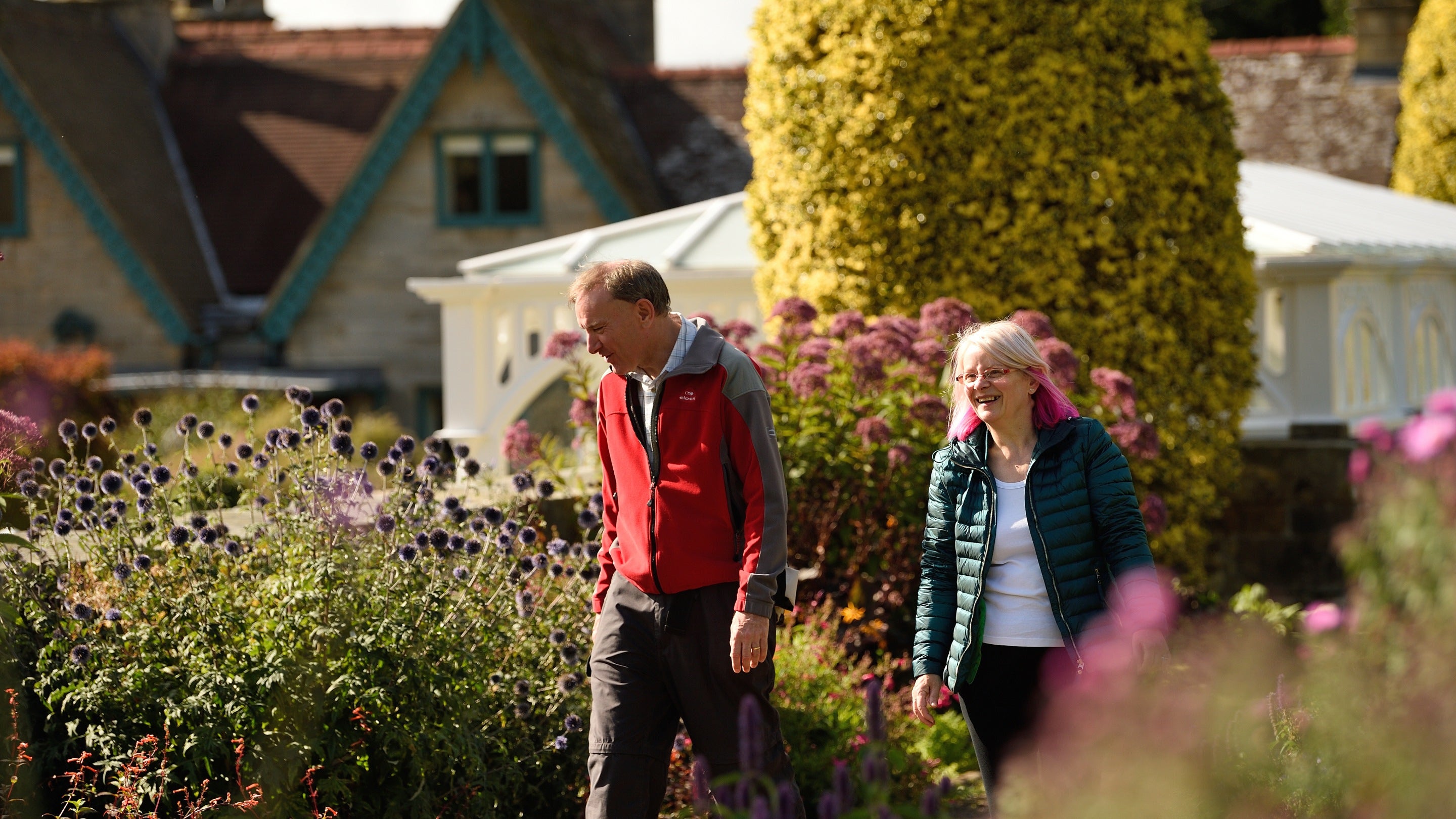 Visitors exploring the Formal Garden at Cragside, Northumberland