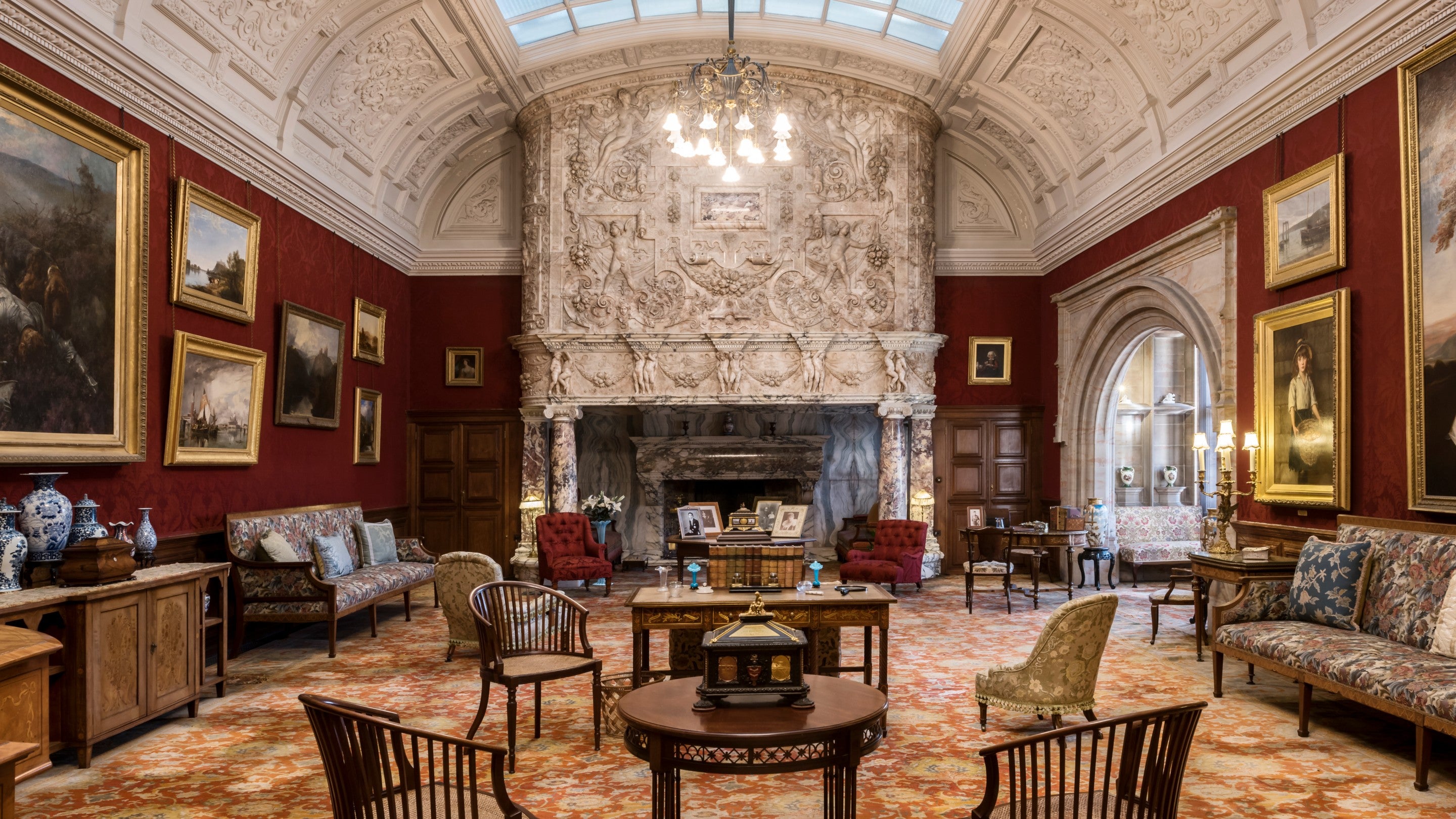 Inside the Drawing Room at Cragside, Northumberland, with its intricately carved marble fireplace.