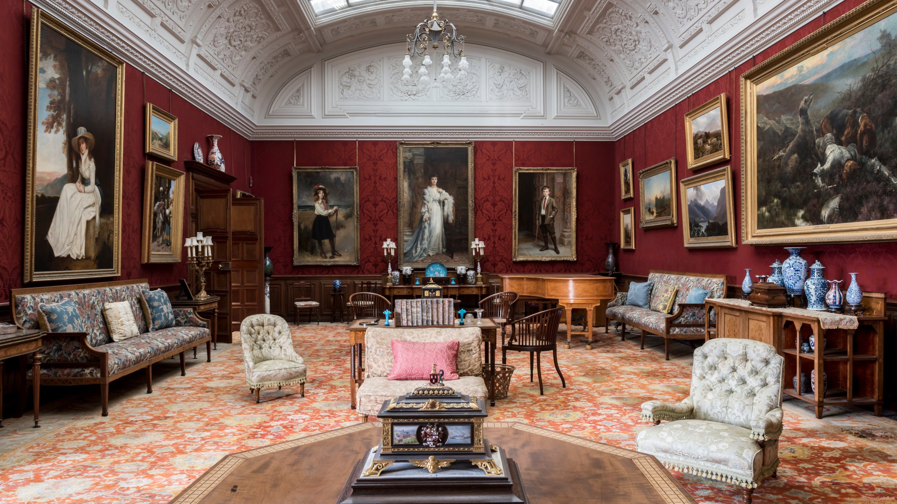 The Drawing Room at Cragside, Northumberland, with its intricate ceiling and richly pattered carpet