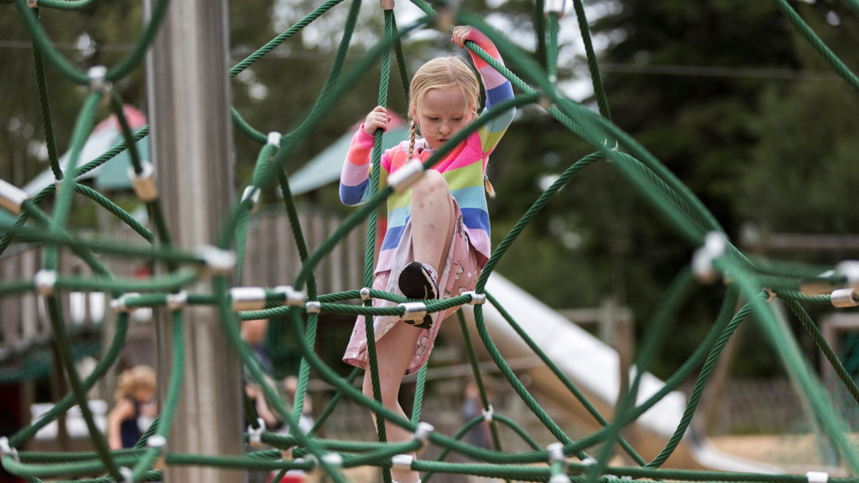 A child climbing the witches hat at Cragside.