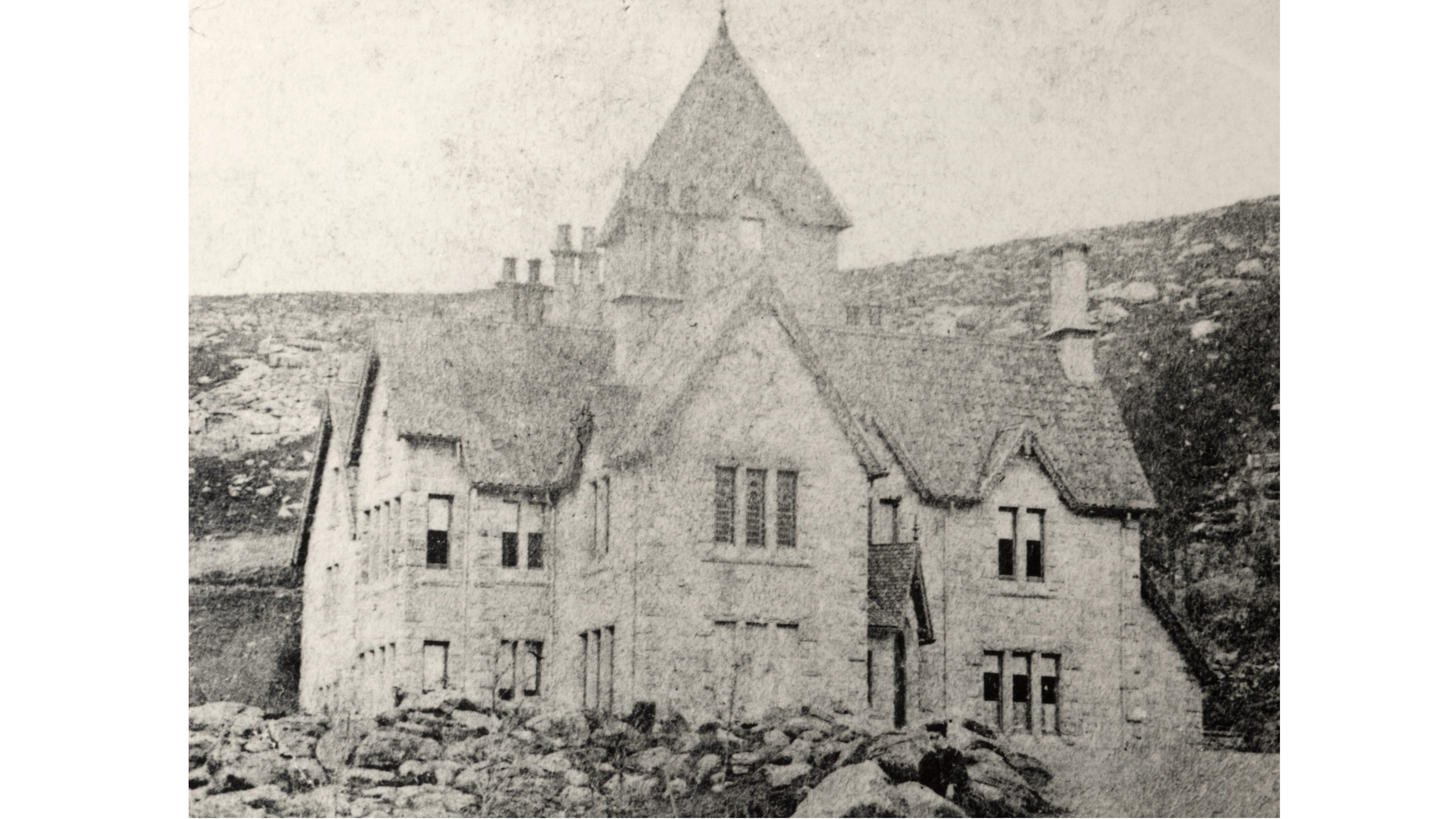 A black and white photograph of Cragside House before it was extended