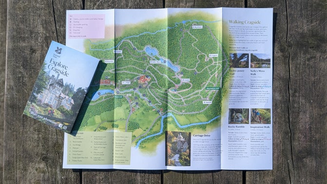 The Explore Cragside leaflet, unfolded to show the map illustration inside.