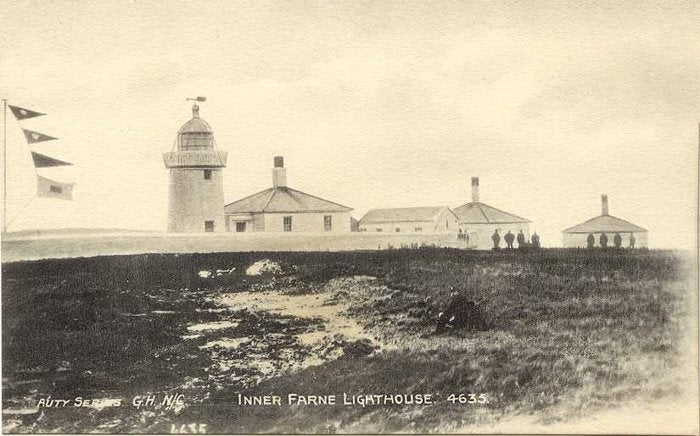 An archive image of Inner Farne lighthouse on the Farne Islands, including the lighthouse cottages.