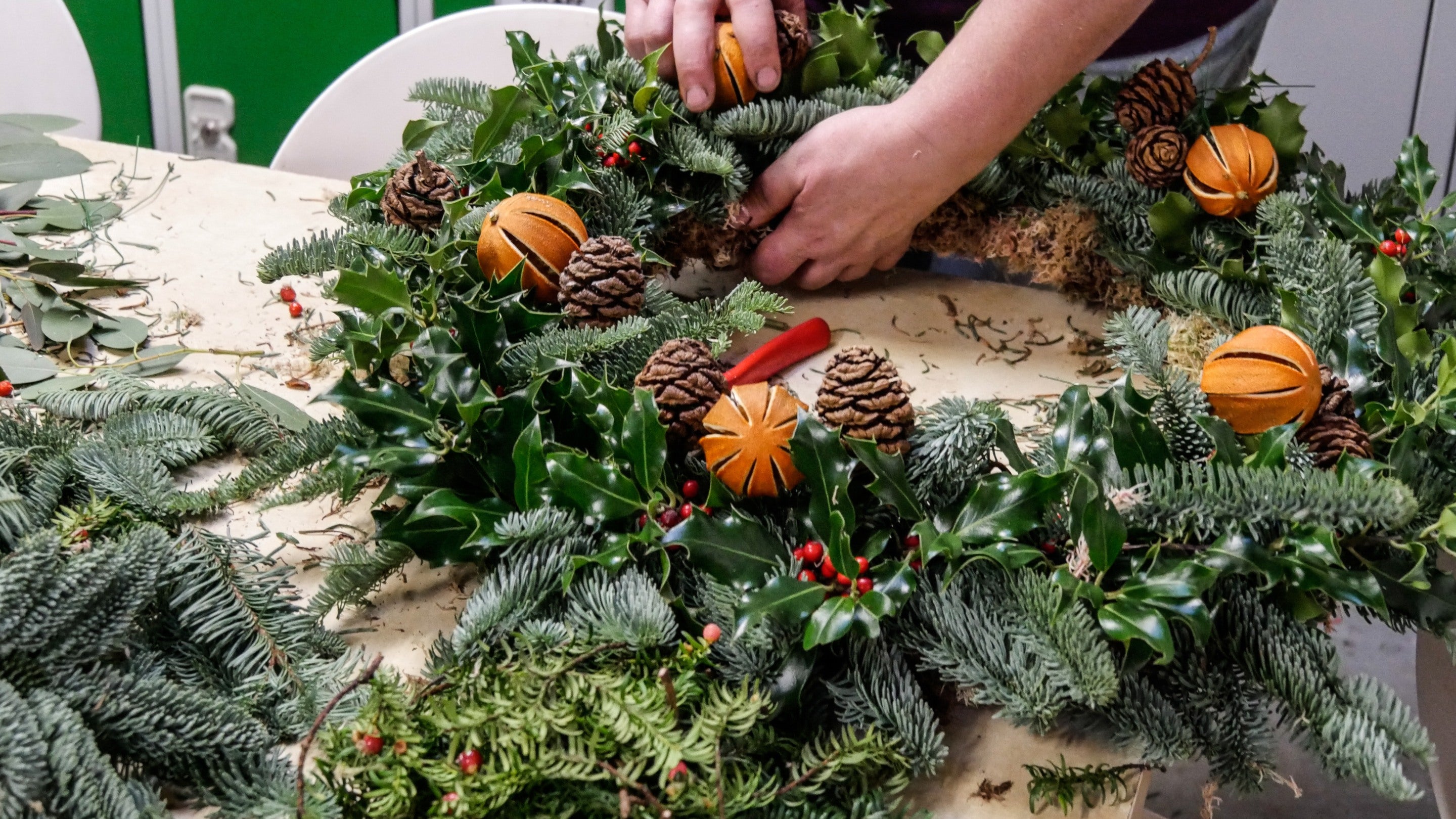Christmas wreath being made using winter foliage at Gibside in Tyne and Wear, North East
