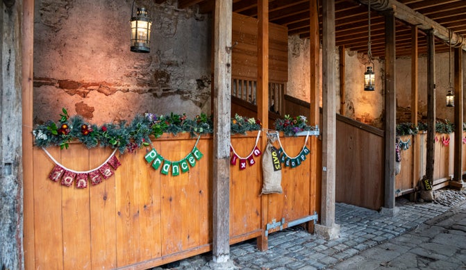 Gibside Stables decorated for Christmas with Father Christmas's reindeer names on each stall