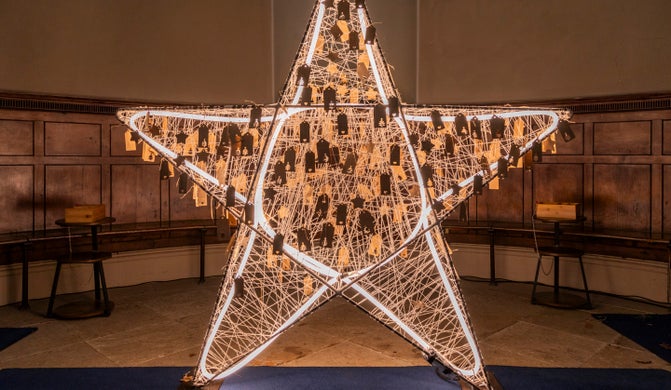 The brightly lit Wishing Star glowing at Gibside Chapel