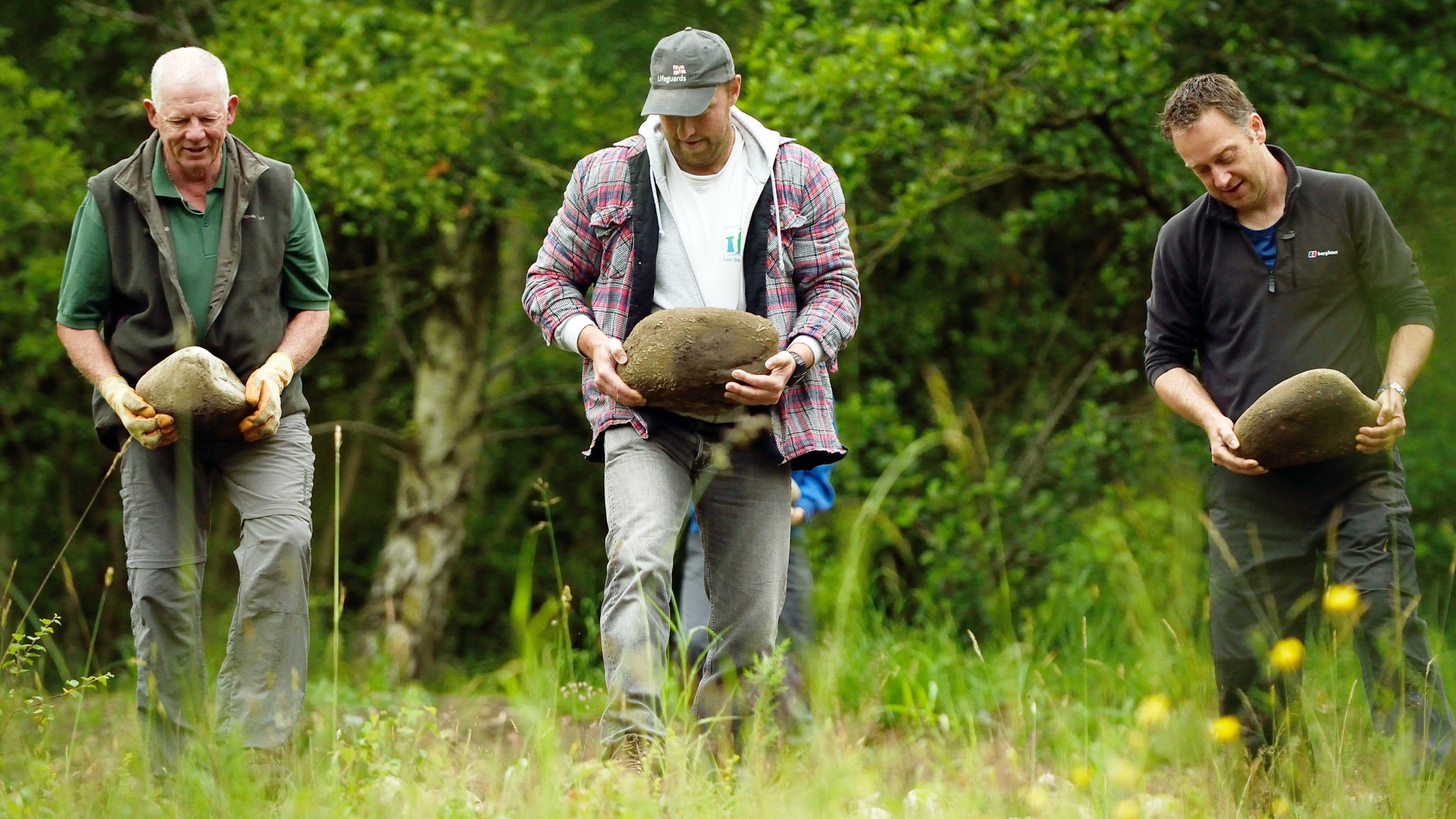 Volunteers carrying stones on the Bellister Estate, Northumberland