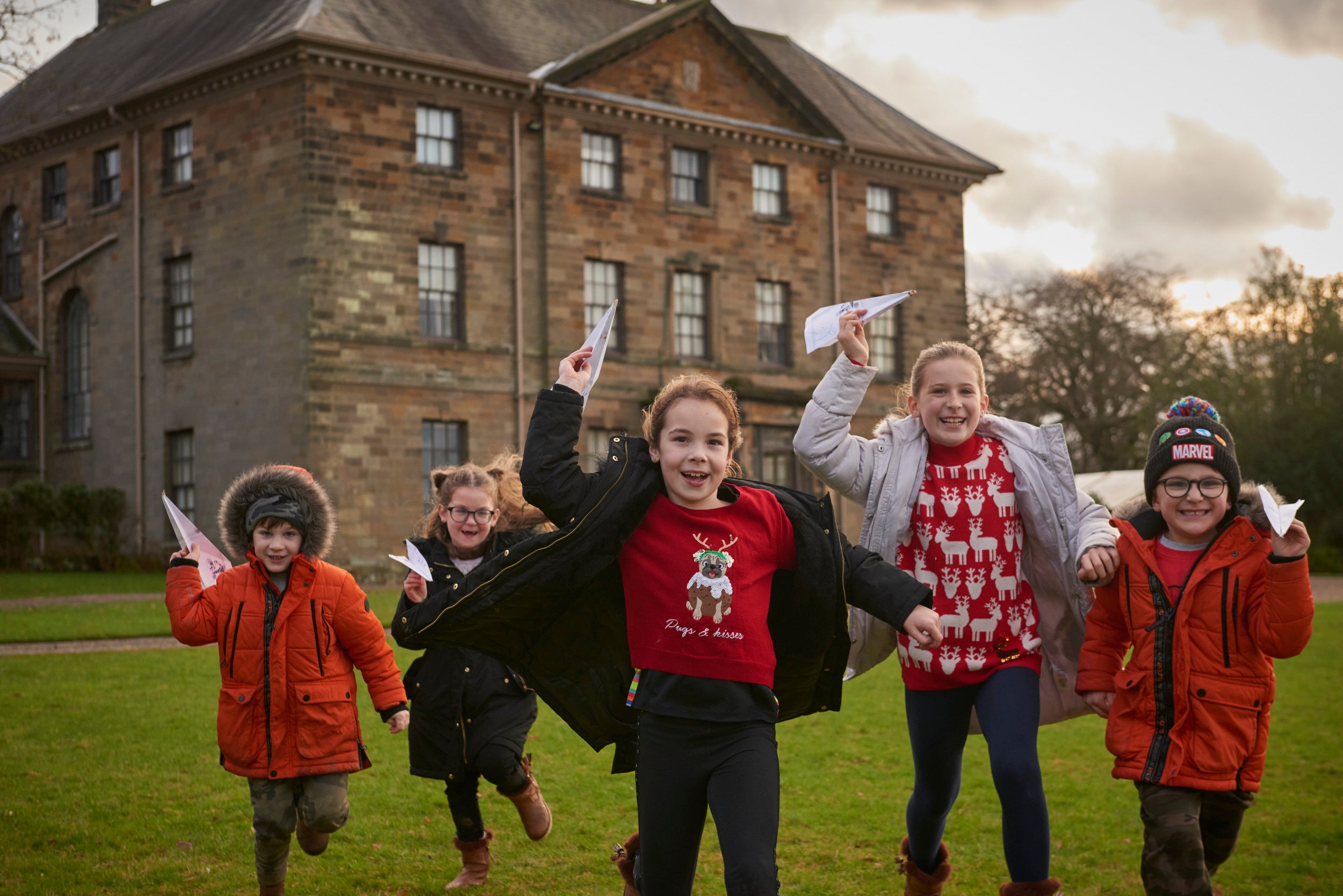 Young visitors exploring the park during their visit at Christmas at Ormesby Hall, North Yorkshire
