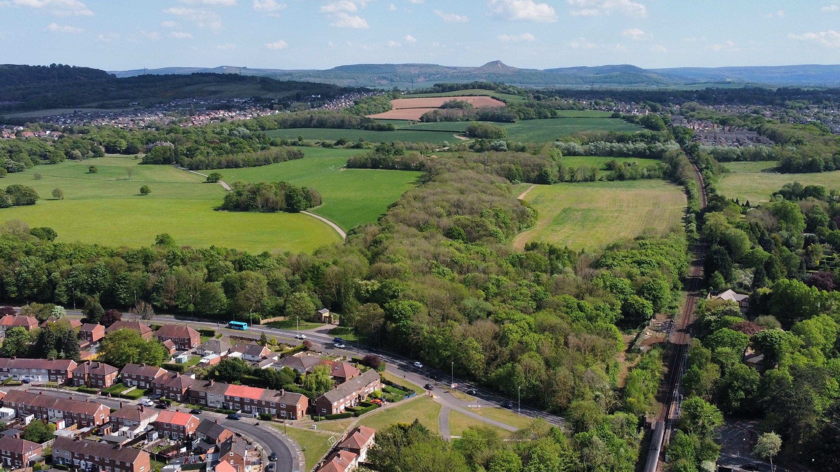Aerial shot showing Marton Station, Ormesby Hall estate and Roseberry Topping in background
