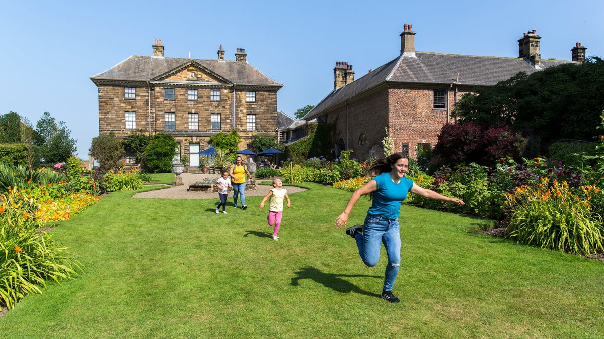 Family running in the grounds at Ormesby Hall