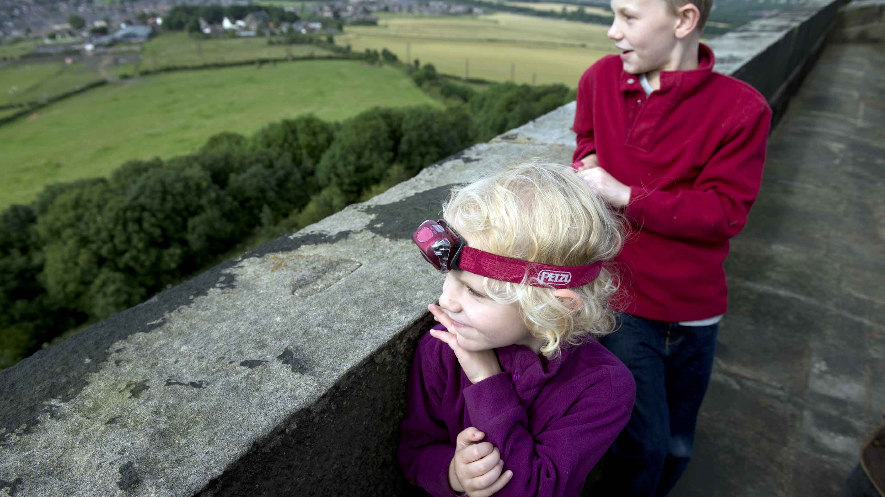 Two young children looking out over the countryside from Penshaw Monument, Sunderland