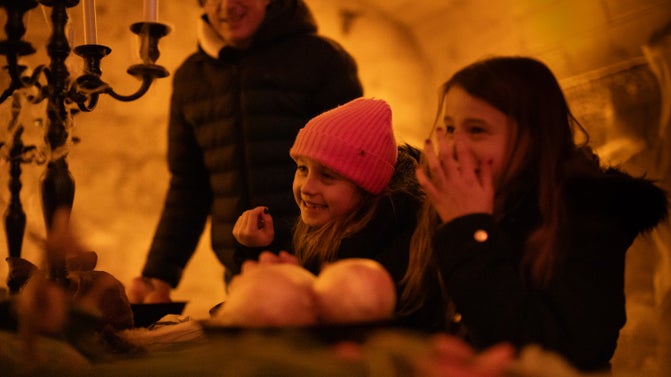 a family exploring the Halloween decorations in Northumberland's Seaton Delaval Hall in the Basement