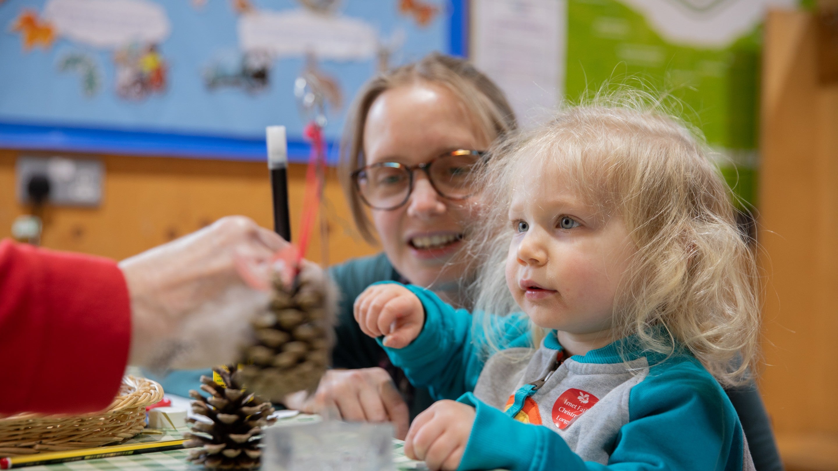 a child enjoying Christmas crafts