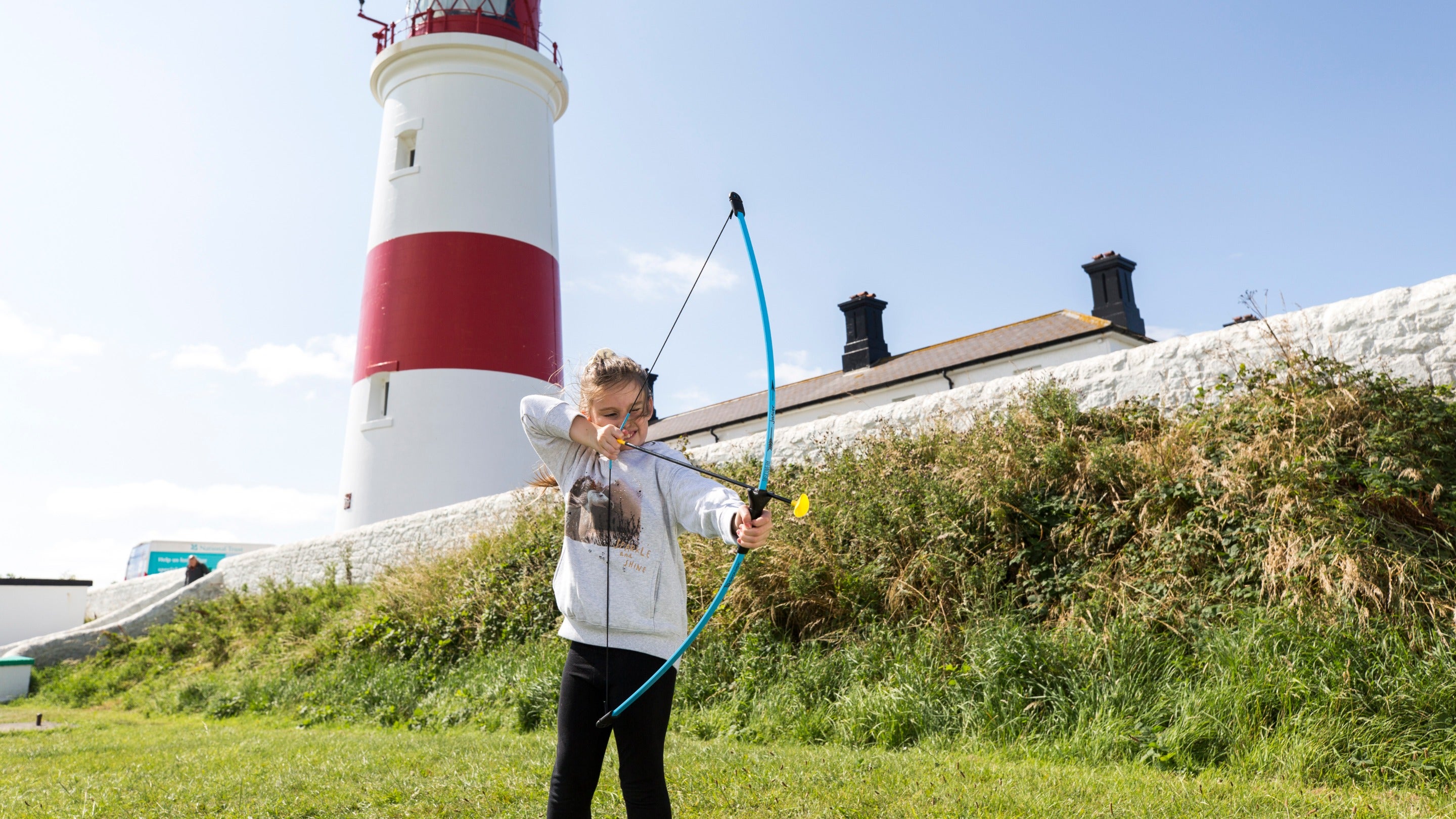 Child with bow and arrow during the Summer of Sport programme at Souter Lighthouse and The Leas, Tyne & Wear