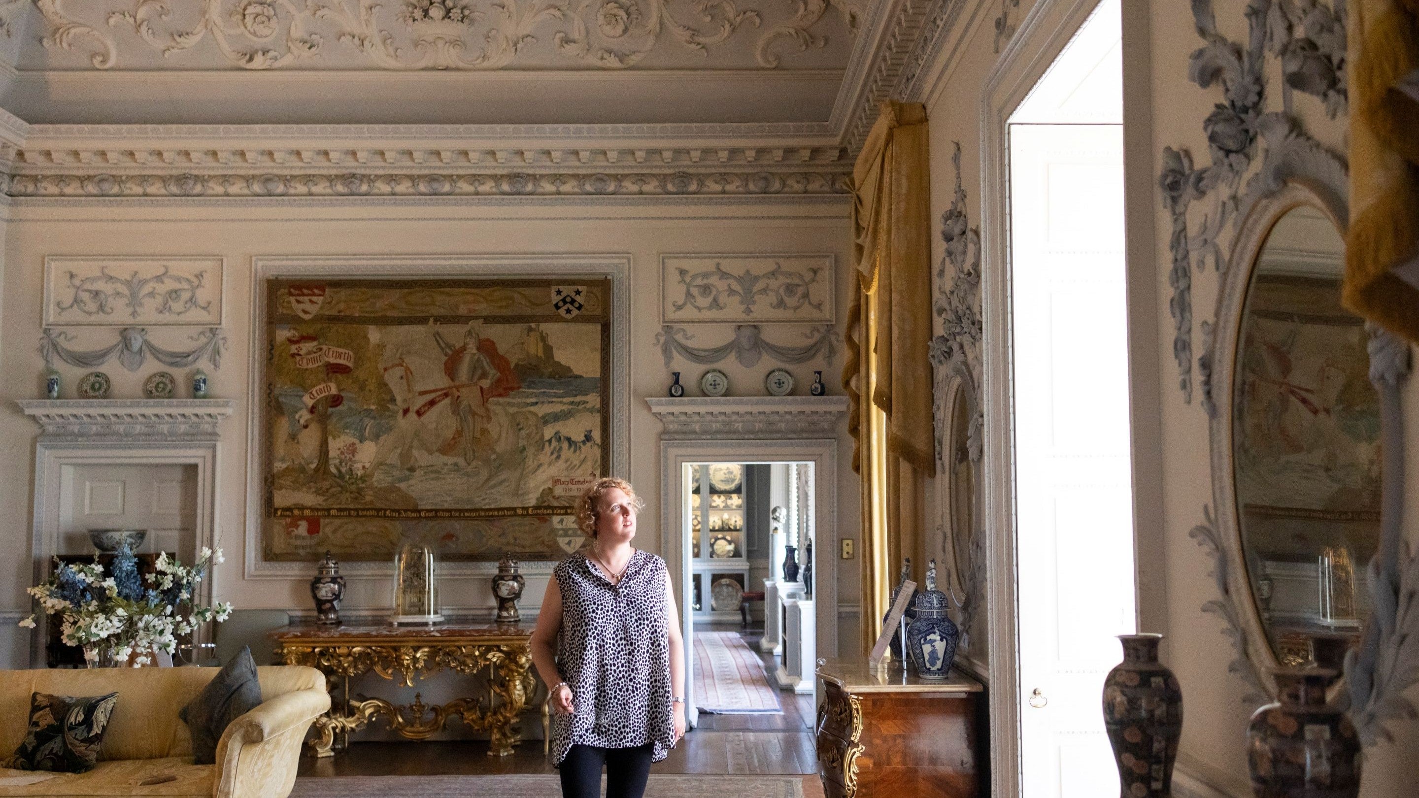 Room view of the Drawing Room at Wallington with a visitor walking through, Northumberland