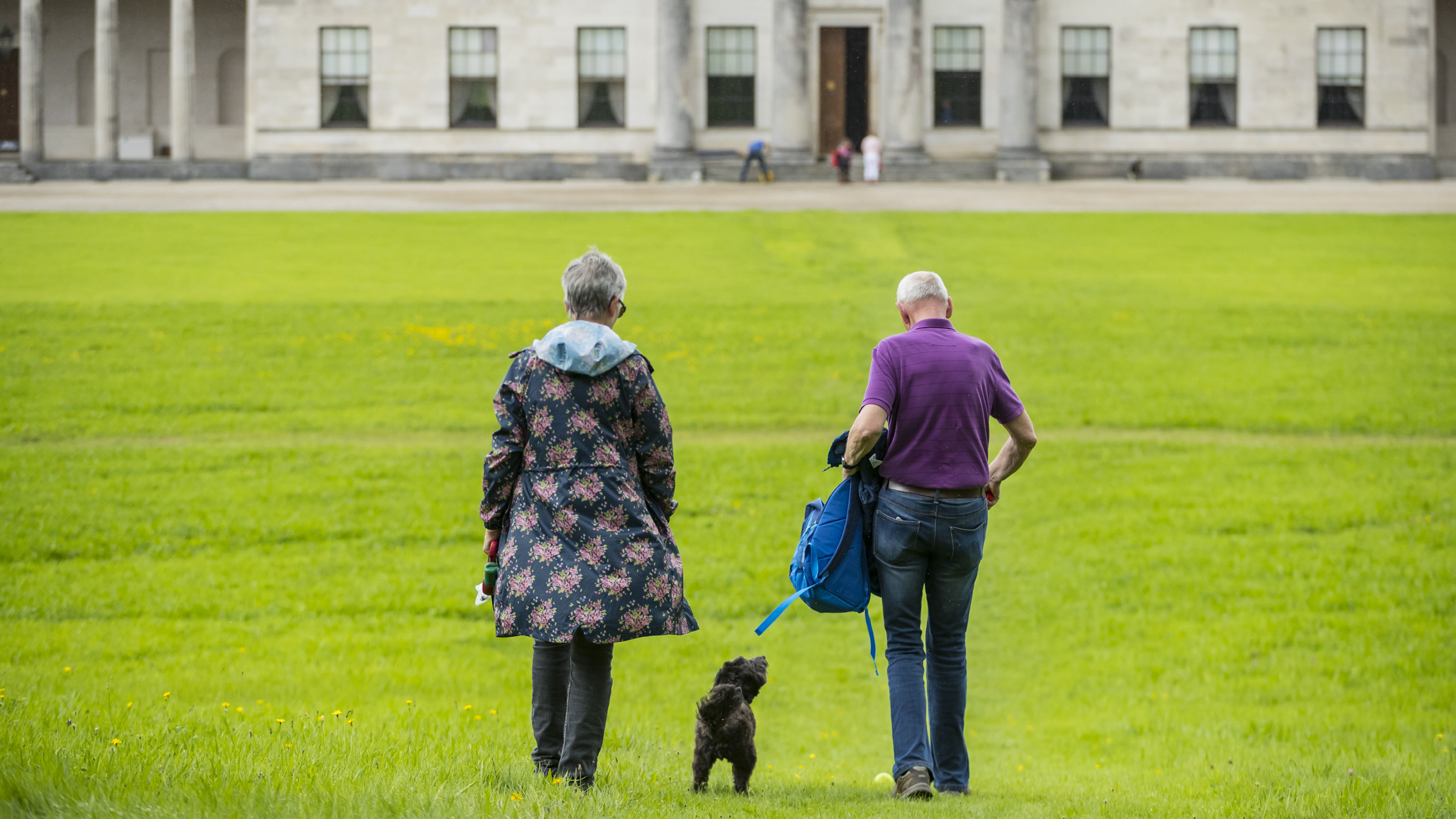 Visitors walking their dog in the grounds of Castle Coole, Co Fermanagh, Northern Ireland.