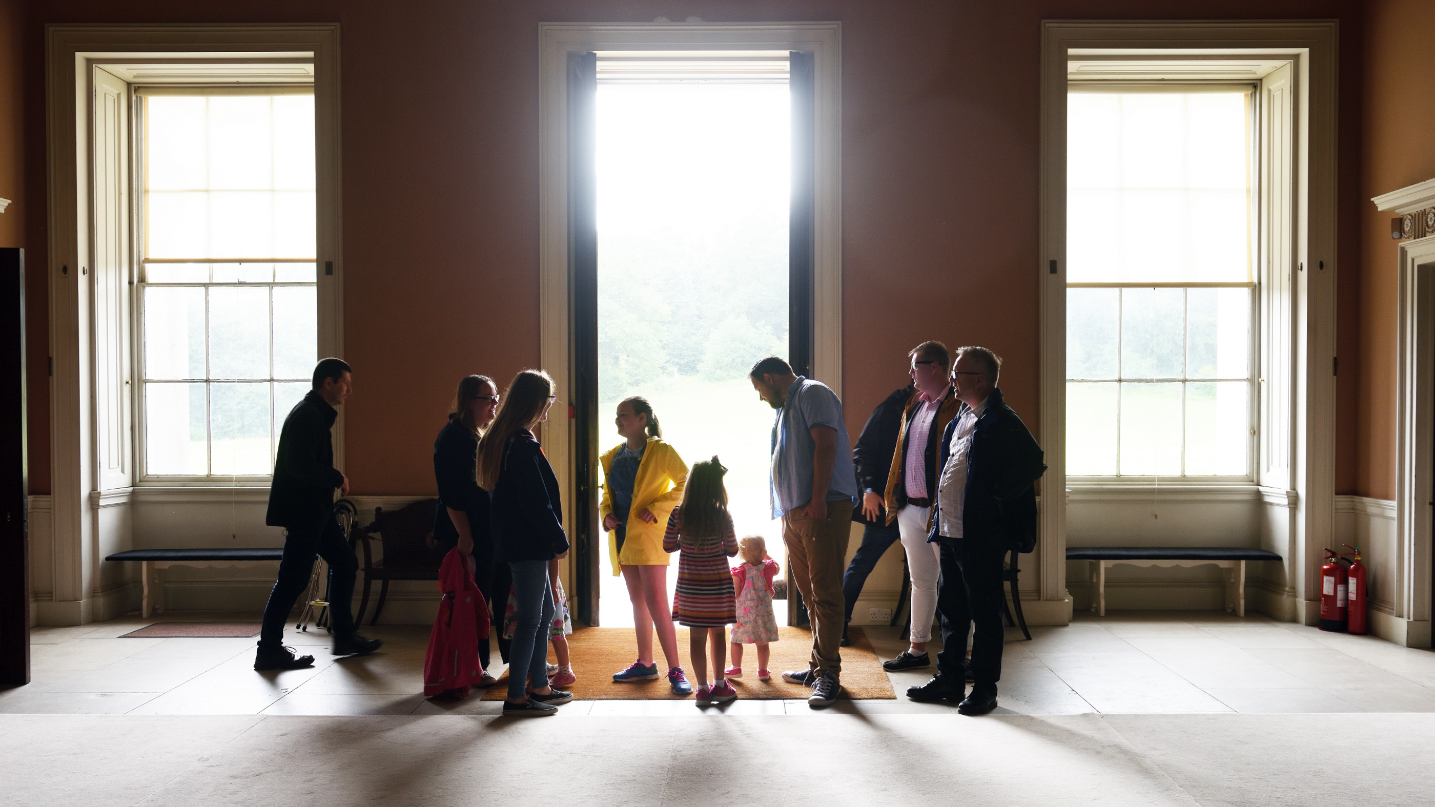 Visitors in the entrance hall at Castle Coole, County Fermanagh, Northern Ireland.
