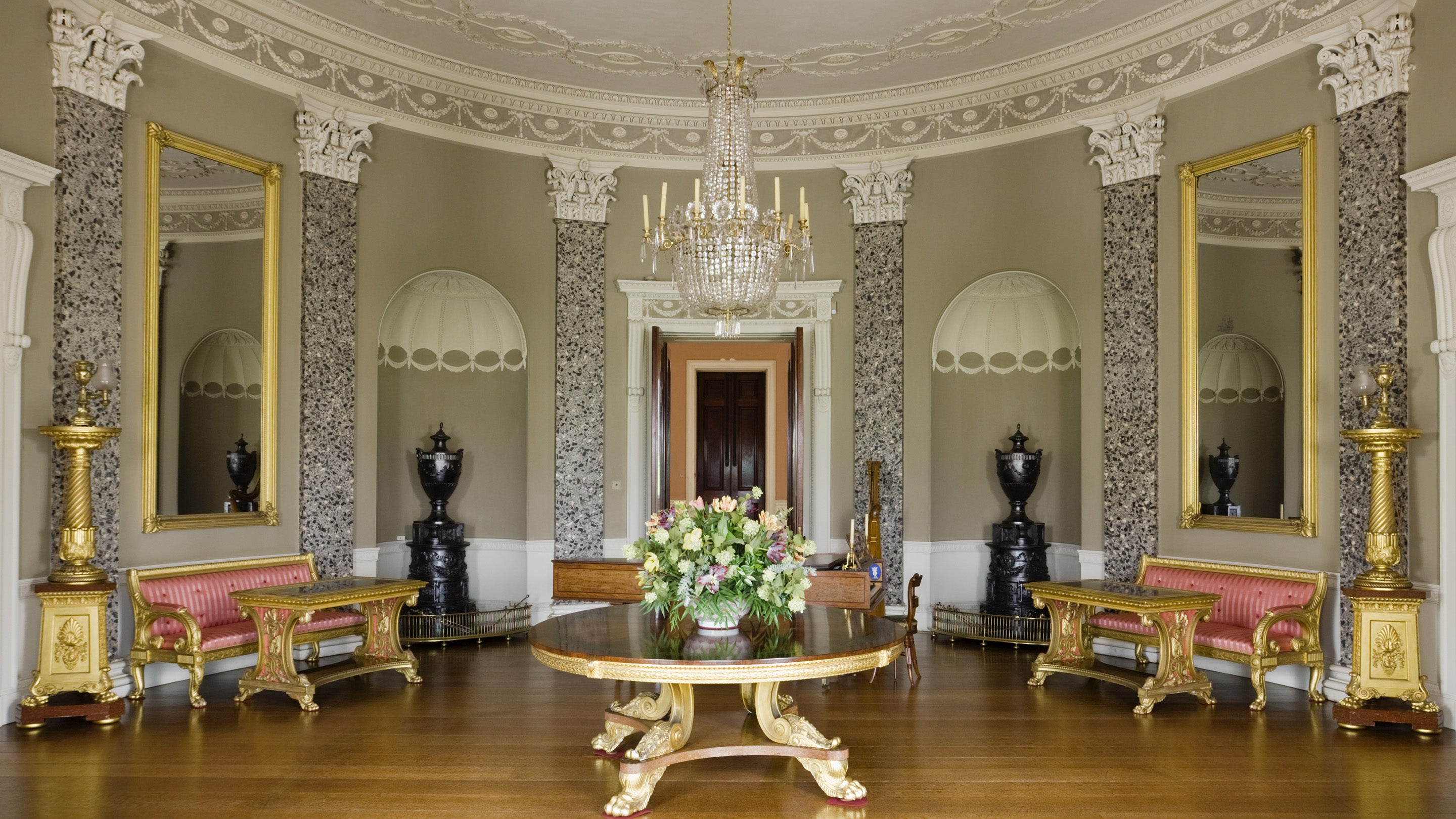 The Saloon, designed by James Wyatt (1746-1813), with ornate plasterwork ceiling by Joseph Rose and scagliola Corinthian pilasters interspersed with niches at Castle Coole, Enniskillen, Co Fermanagh