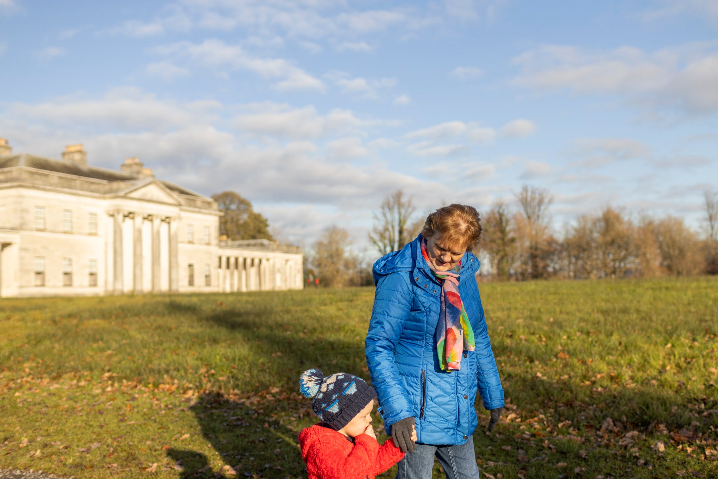 Family walking at Castle Coole in Winter