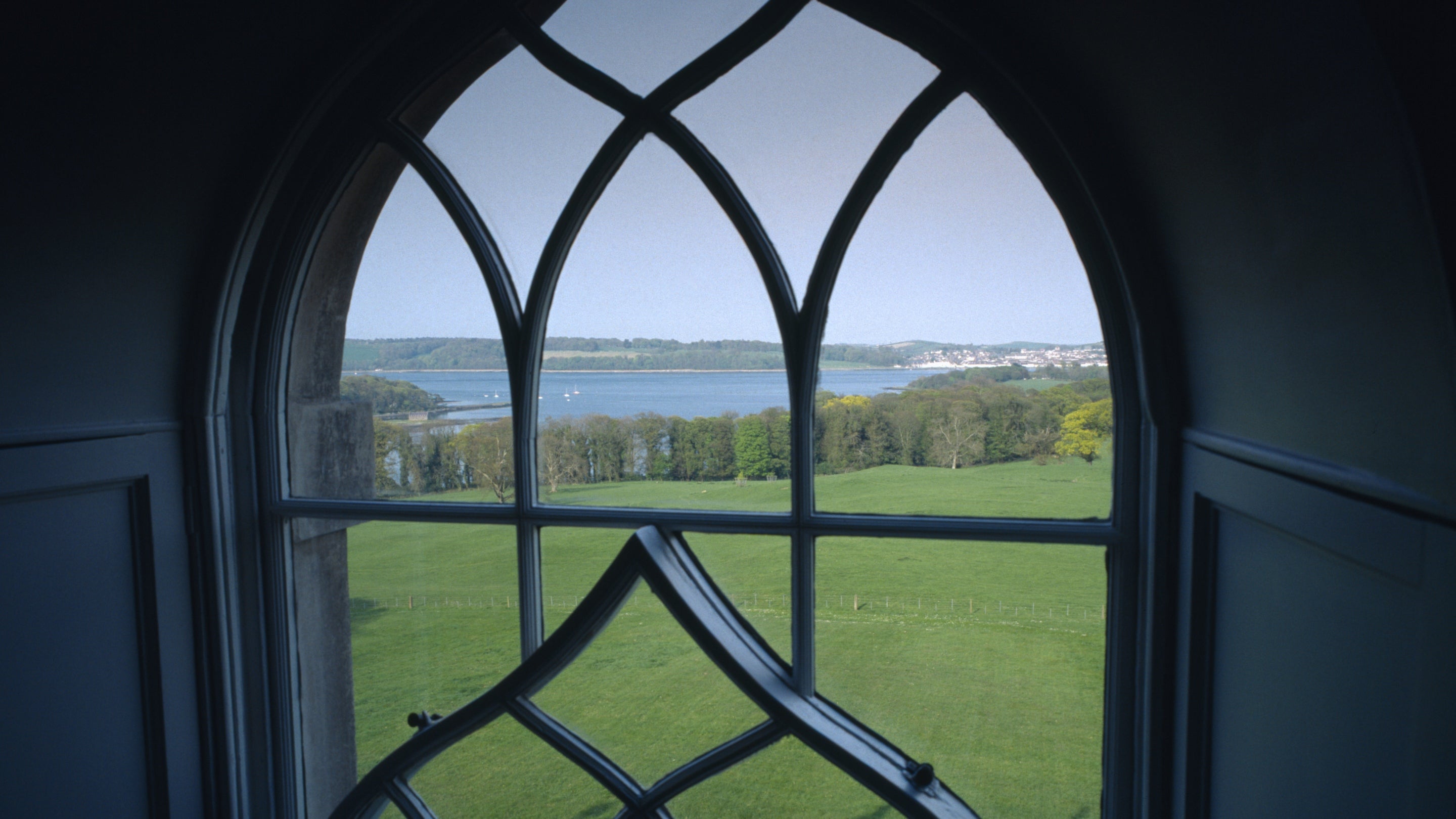 The view towards Strangford Lough from one of the Gothic-revival windows set in the north east front of Castle Ward in County Down, Northern Ireland.