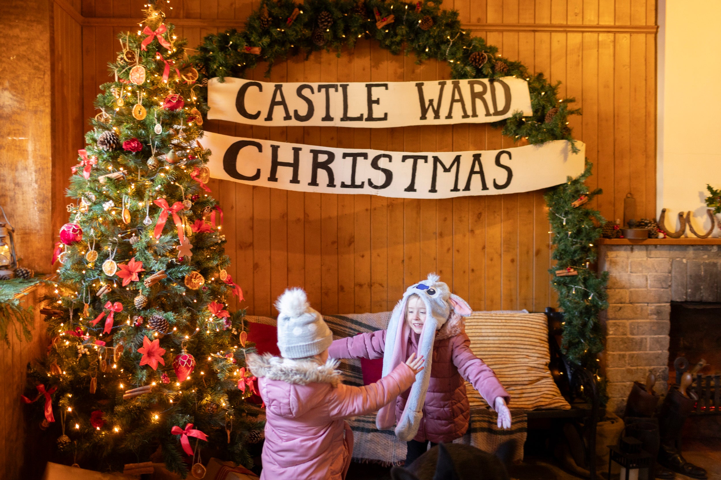 Visitors browsing locally crafted gifts at the Christmas market Castle Ward