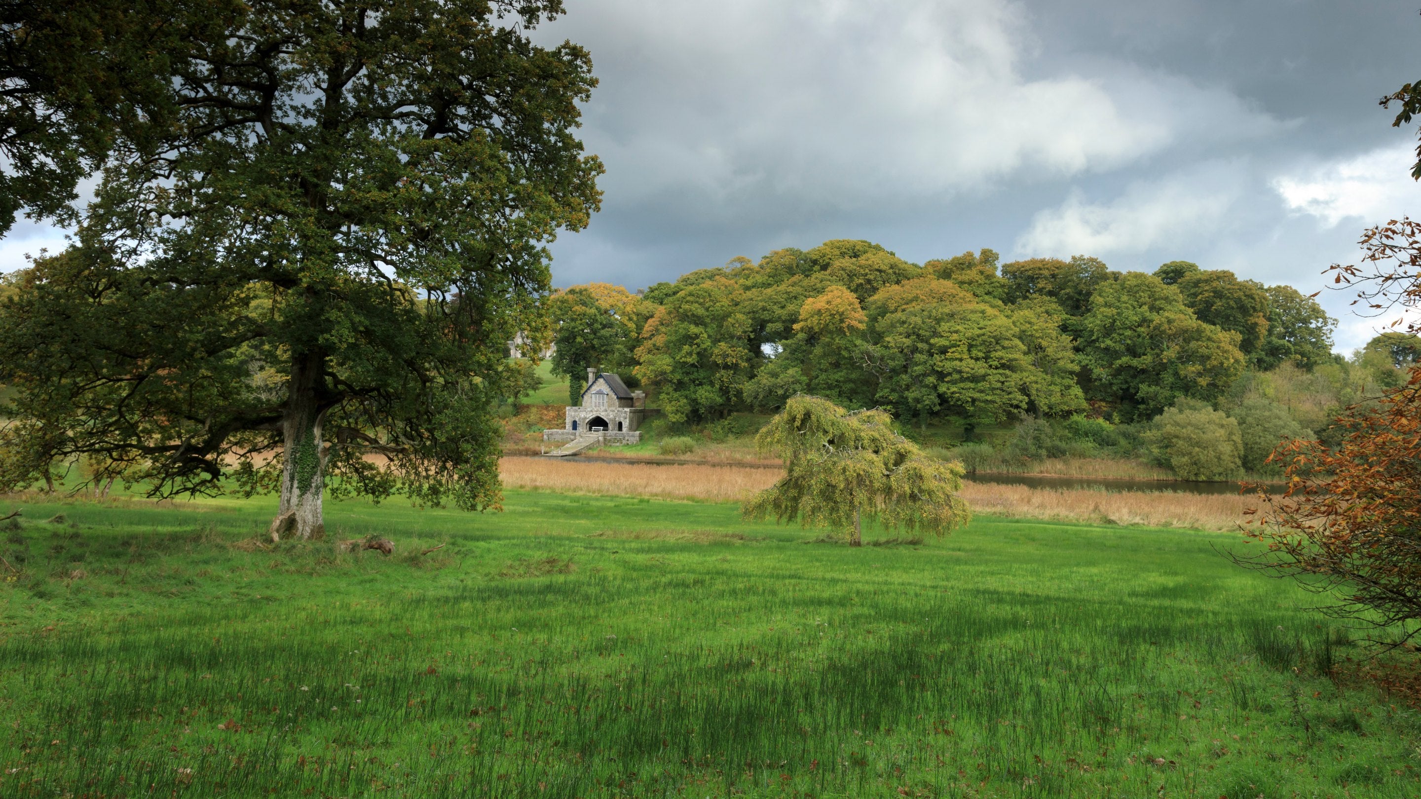 View of the boathouse across the parkland at Crom, County Fermanagh