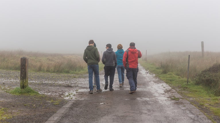 Walkers on a misty trail at Divis and the Black Mountain