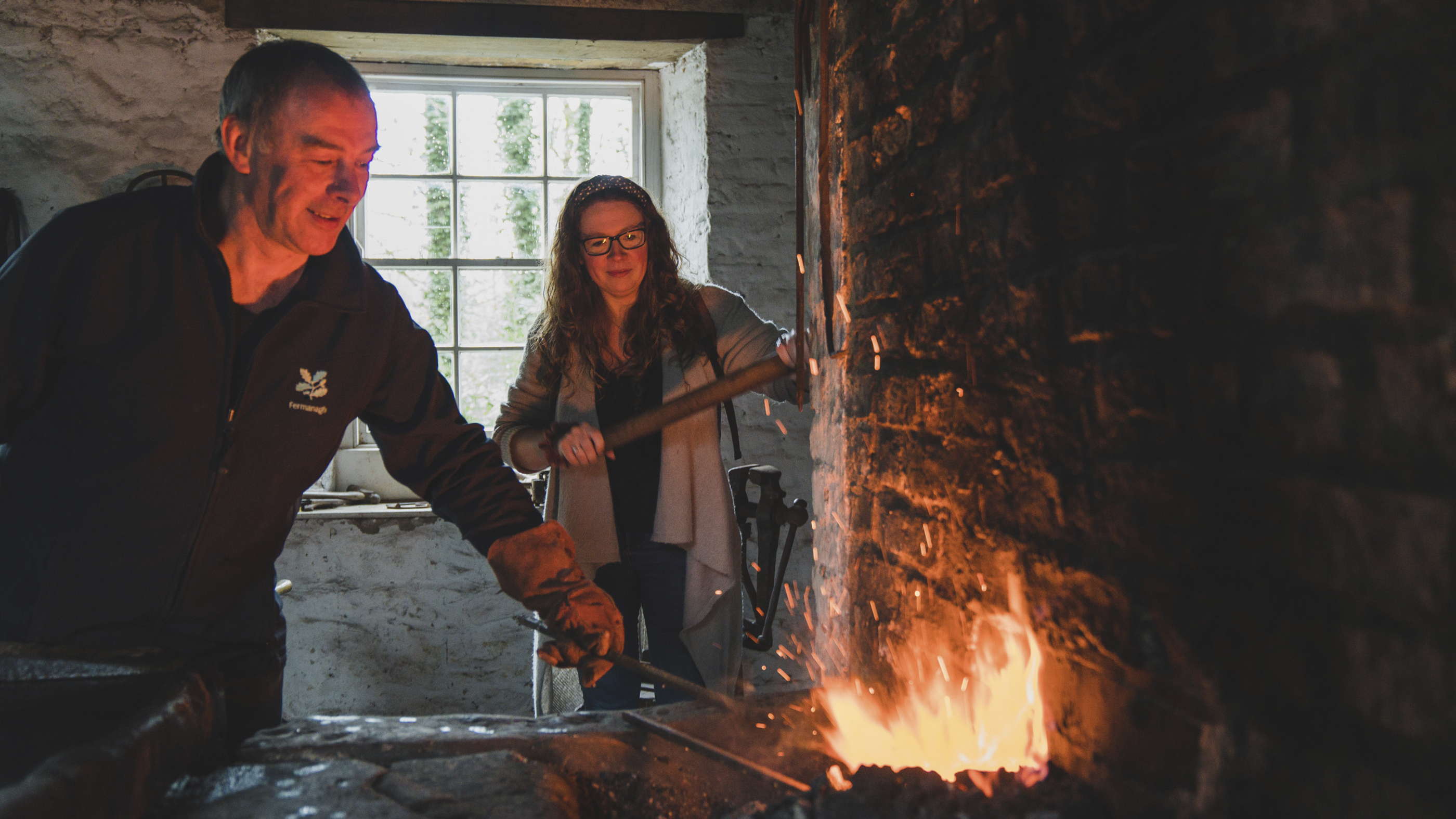 Blacksmith demonstration in the Forge at Florence Court, County Fermanagh, Northern Ireland.