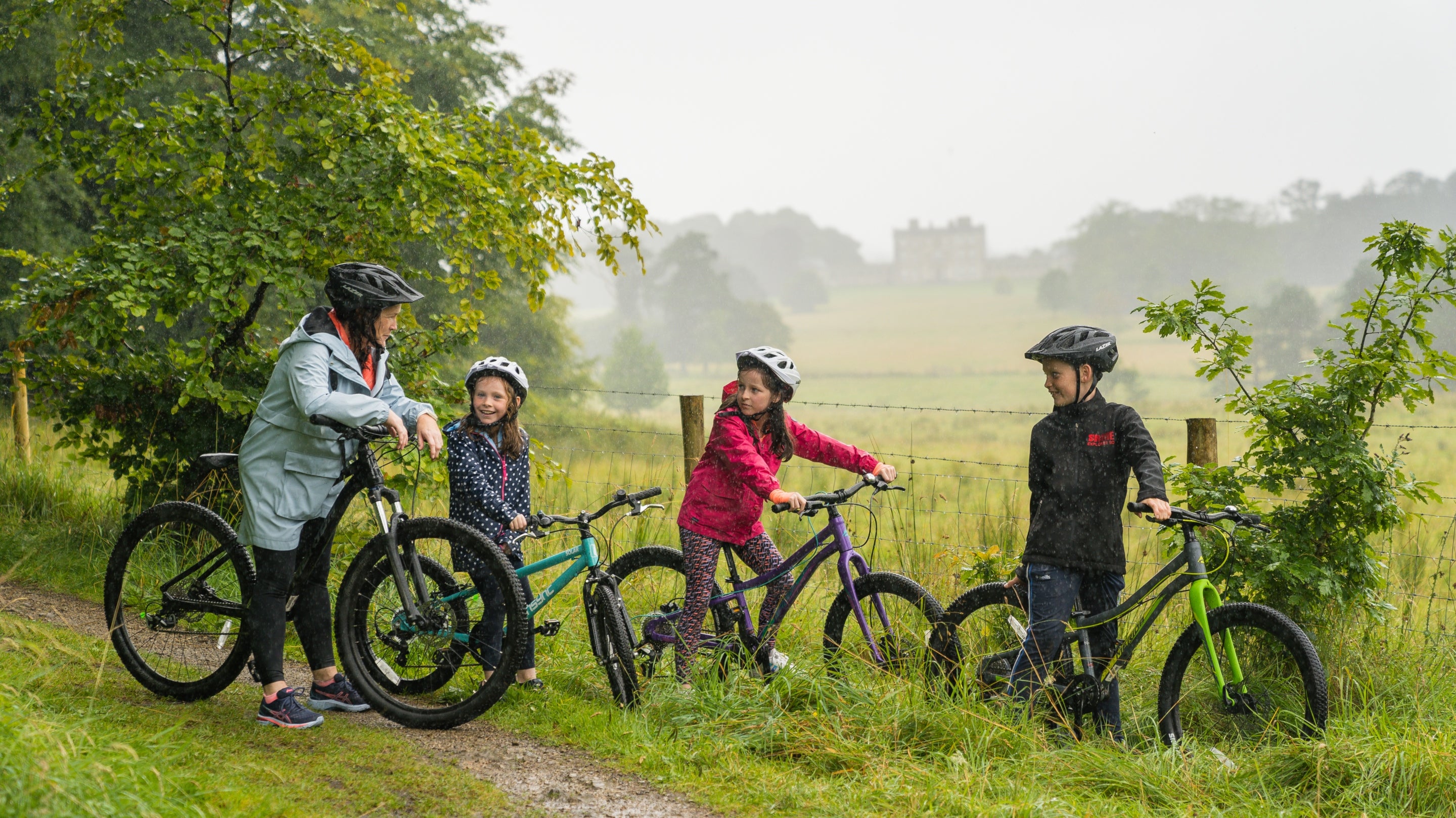 Family visitors on a bike hire with Florence Court house in the background, Florence Court, Co. Fermanagh