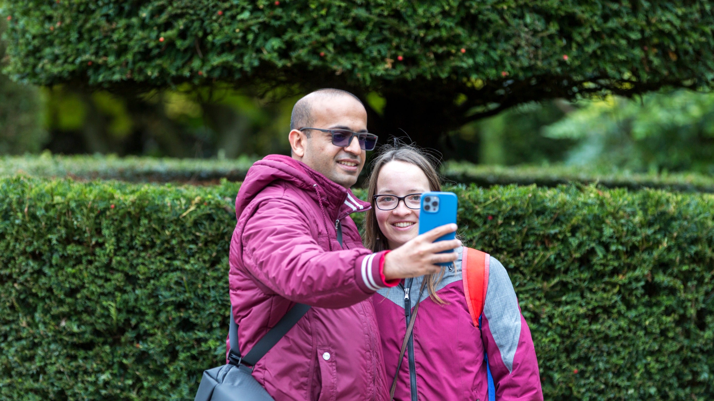 Visitors use a phone in the formal gardens at Mount Stewart, County Down
