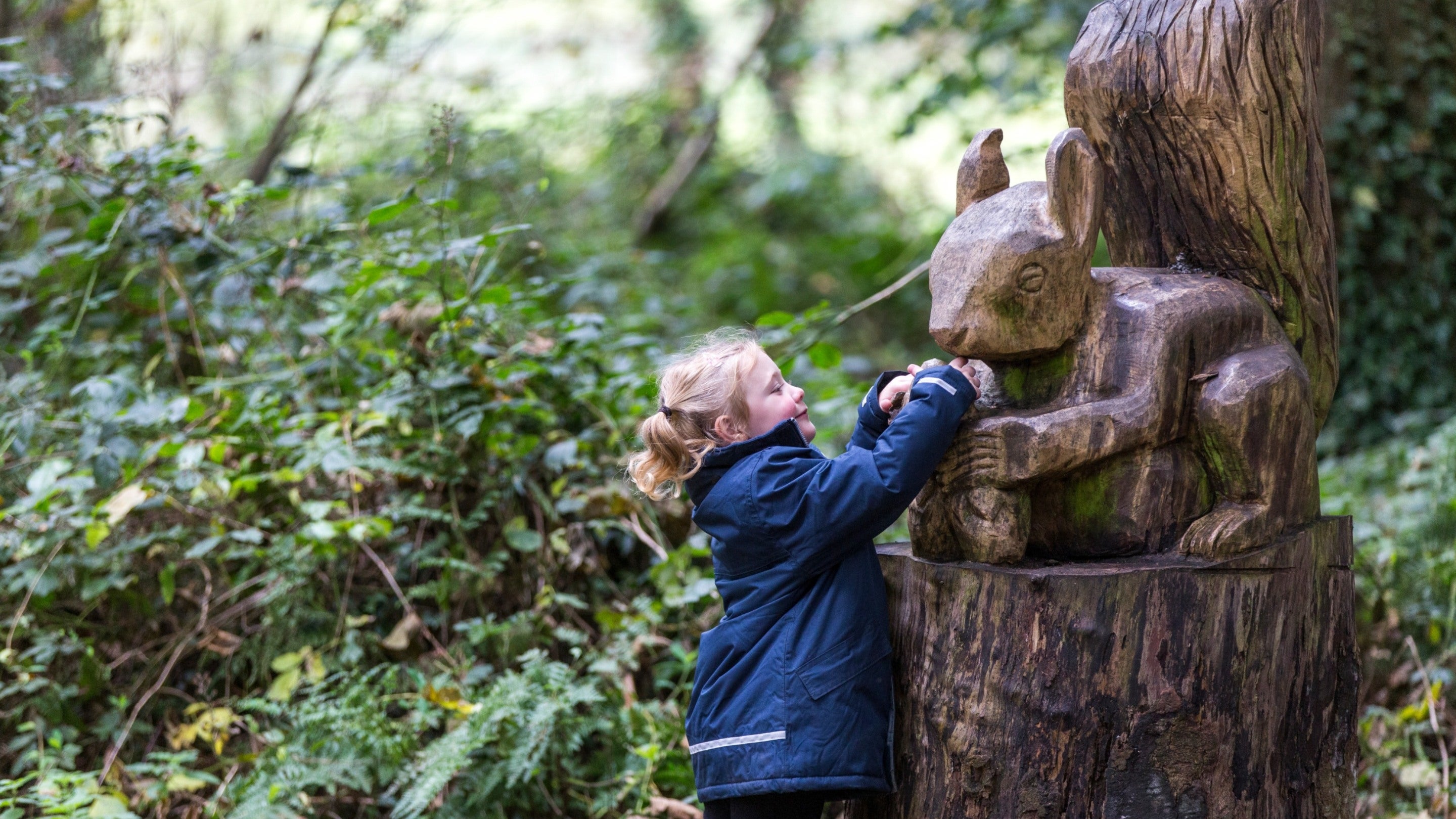 Girl in the natural play area at Mount Stewart, County Down