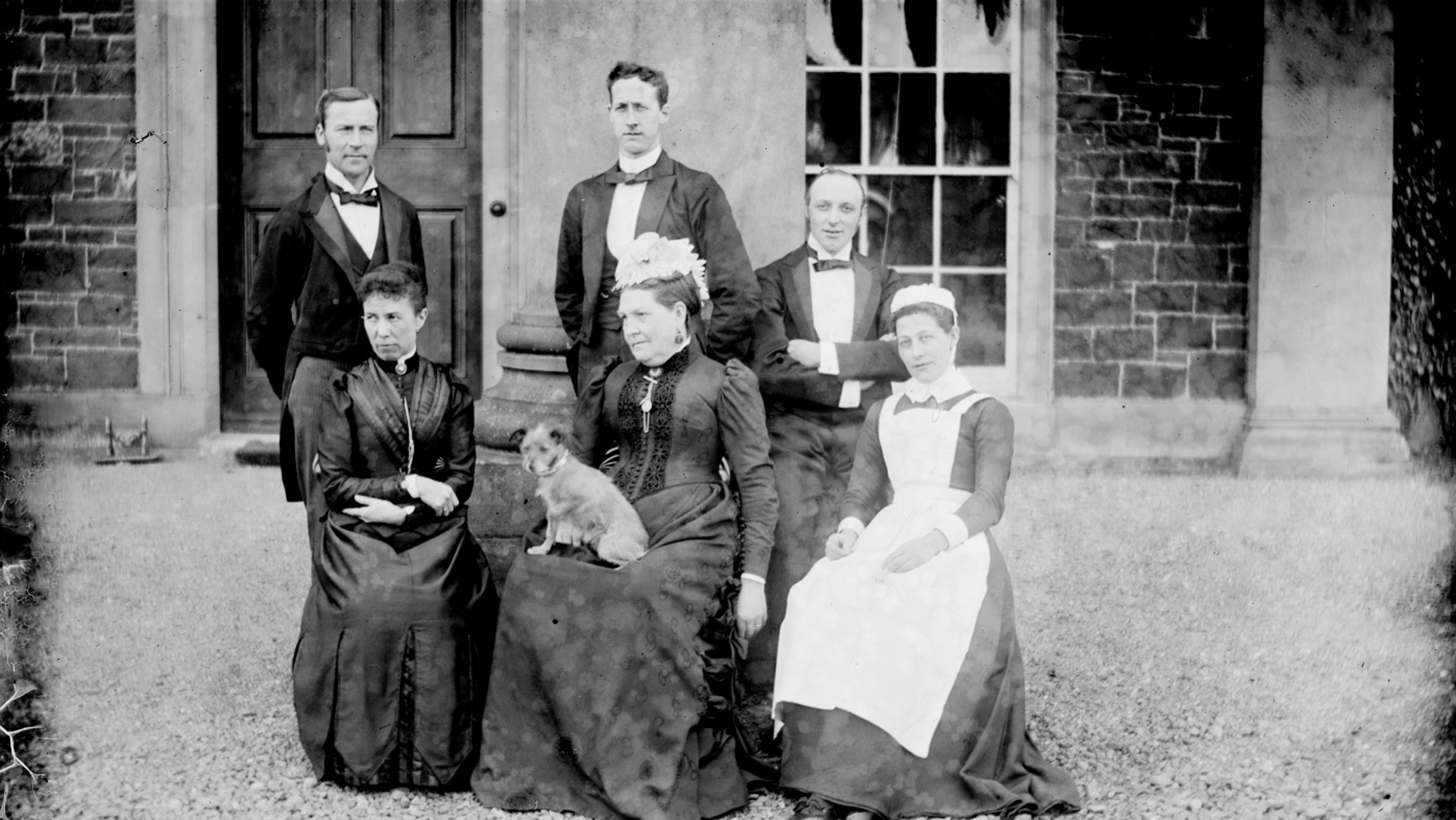 Joseph Grainge (top left) standing with members of staff outside Mount Stewart, County Down