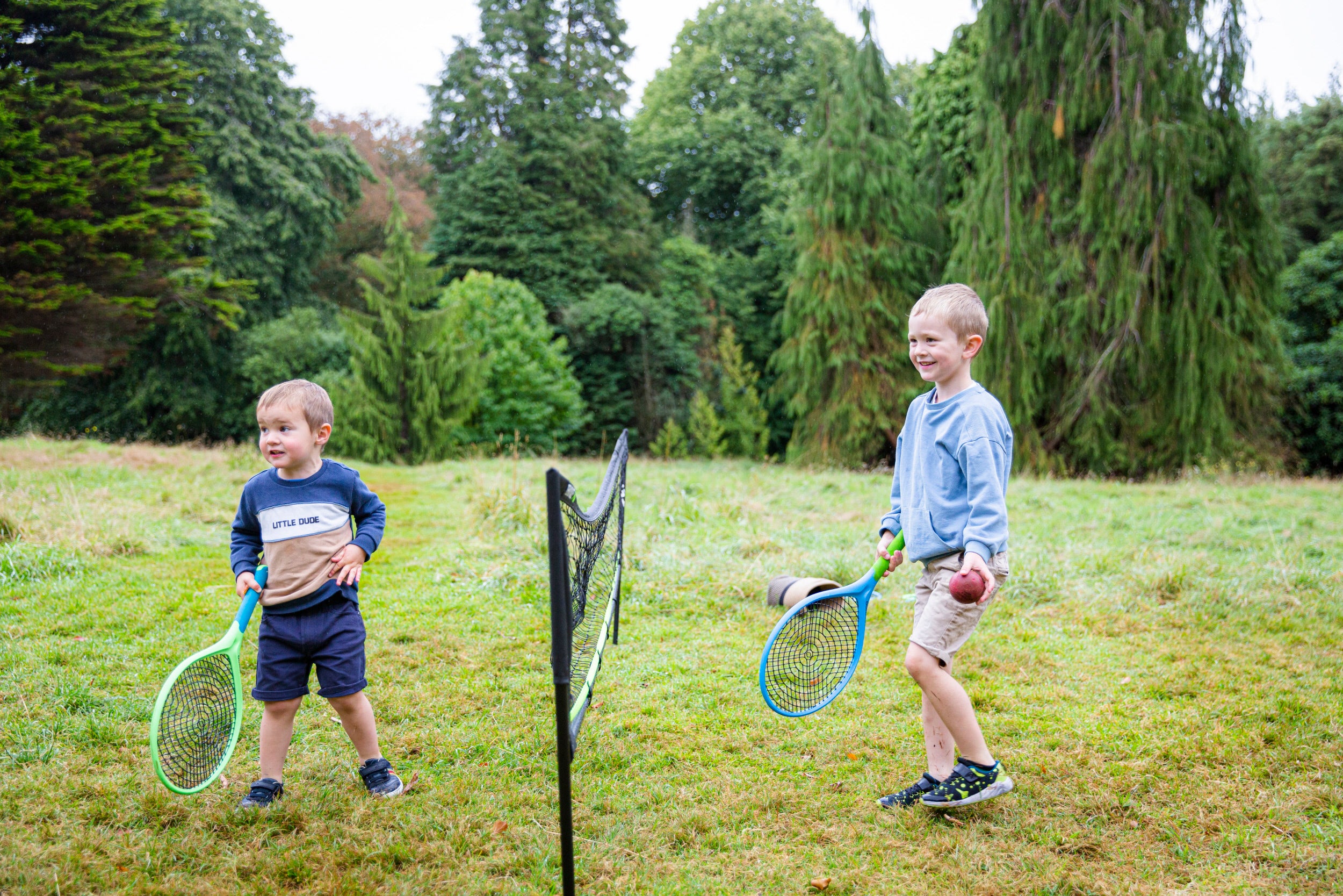 Family playing summer sports at Rowallane Garden, County Down, Northern Ireland