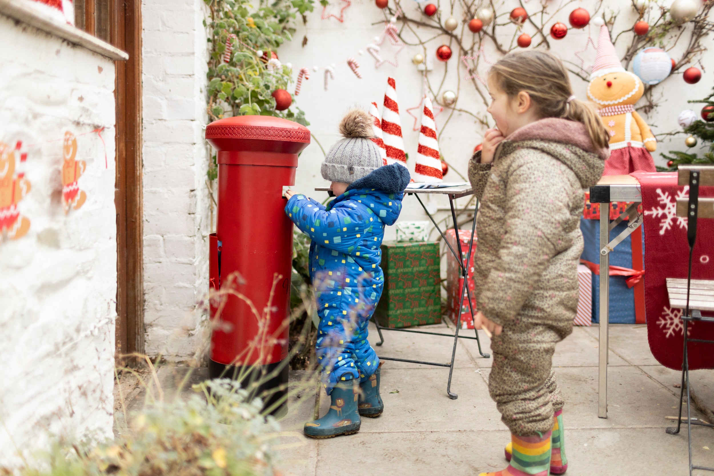 Children posting their letters to Father Christmas in the Conservatory at Christmas at Rowallane Garden, County Down