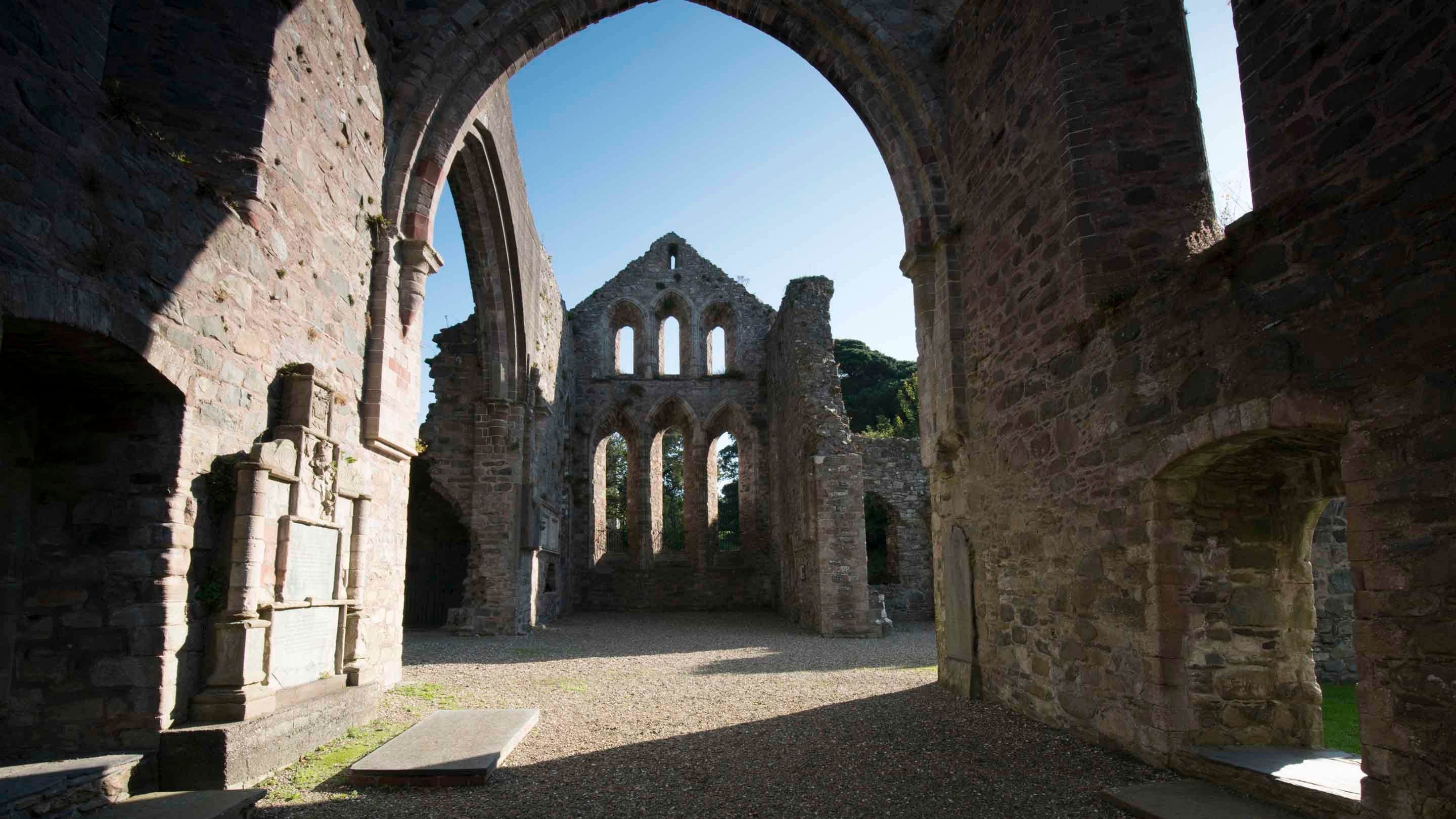 Inside the ruins of the Cistercian priory Grey Abbey, County Down, with its crumbling walls.