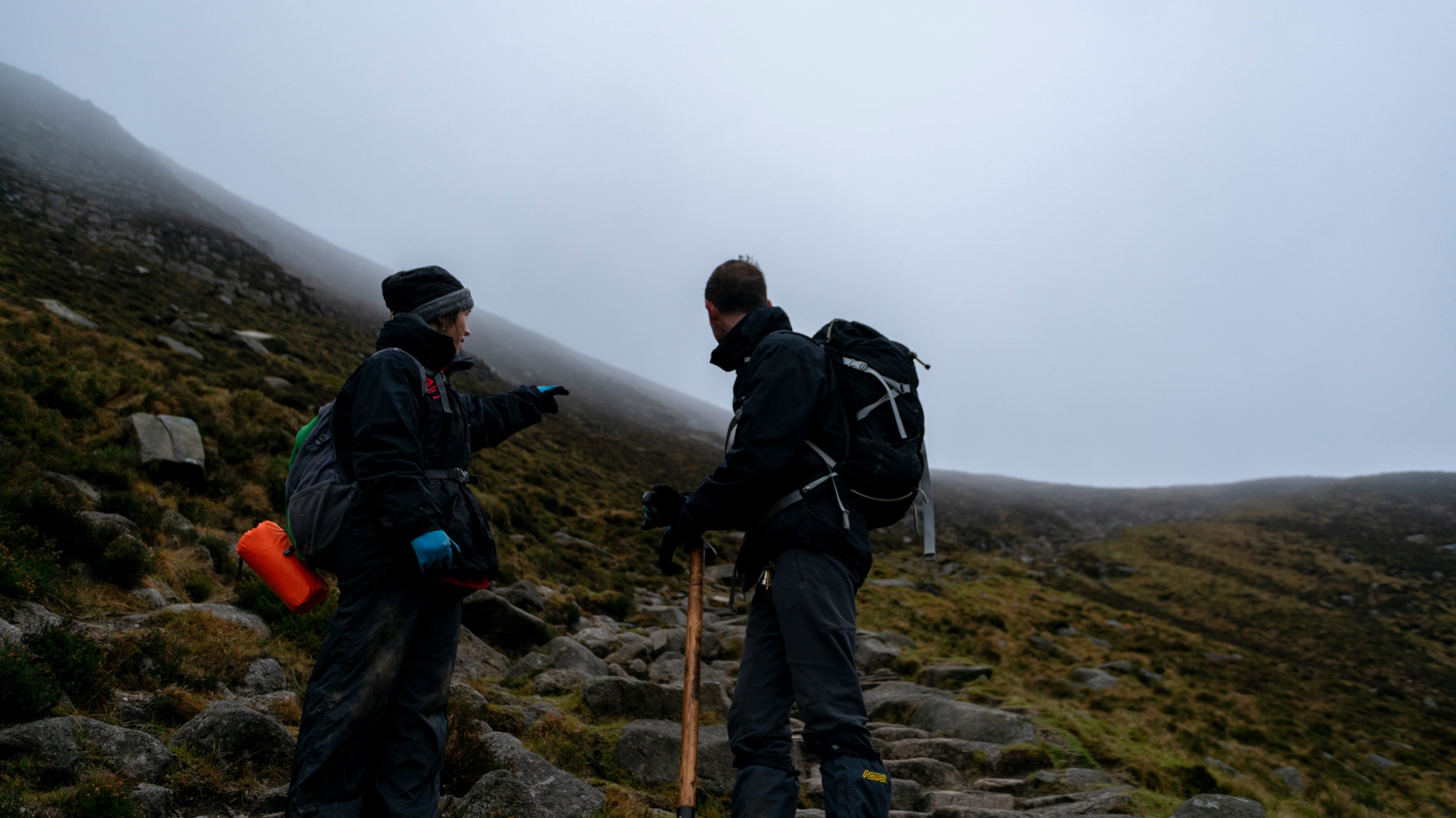 Rangers walking home after a day working to repair the path in the Mournes, County Down, Northern Ireland