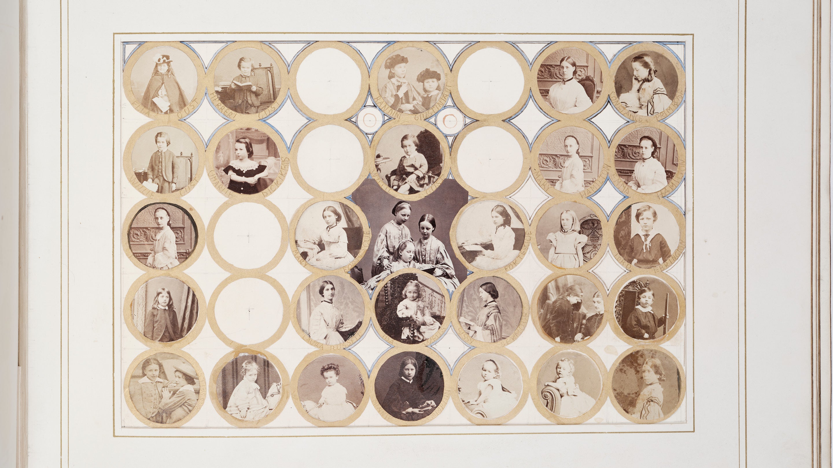 A page from one of Marian Alford's photograph albums with individual photographs cut into small circular frames around a central image of young girls.
