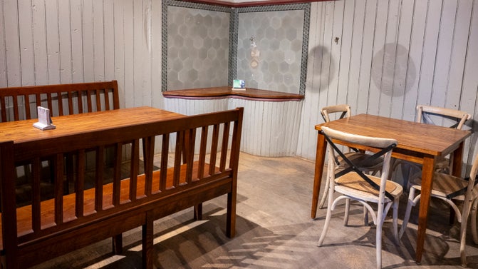 Individual table and chairs seating at Belton's Stables Café.