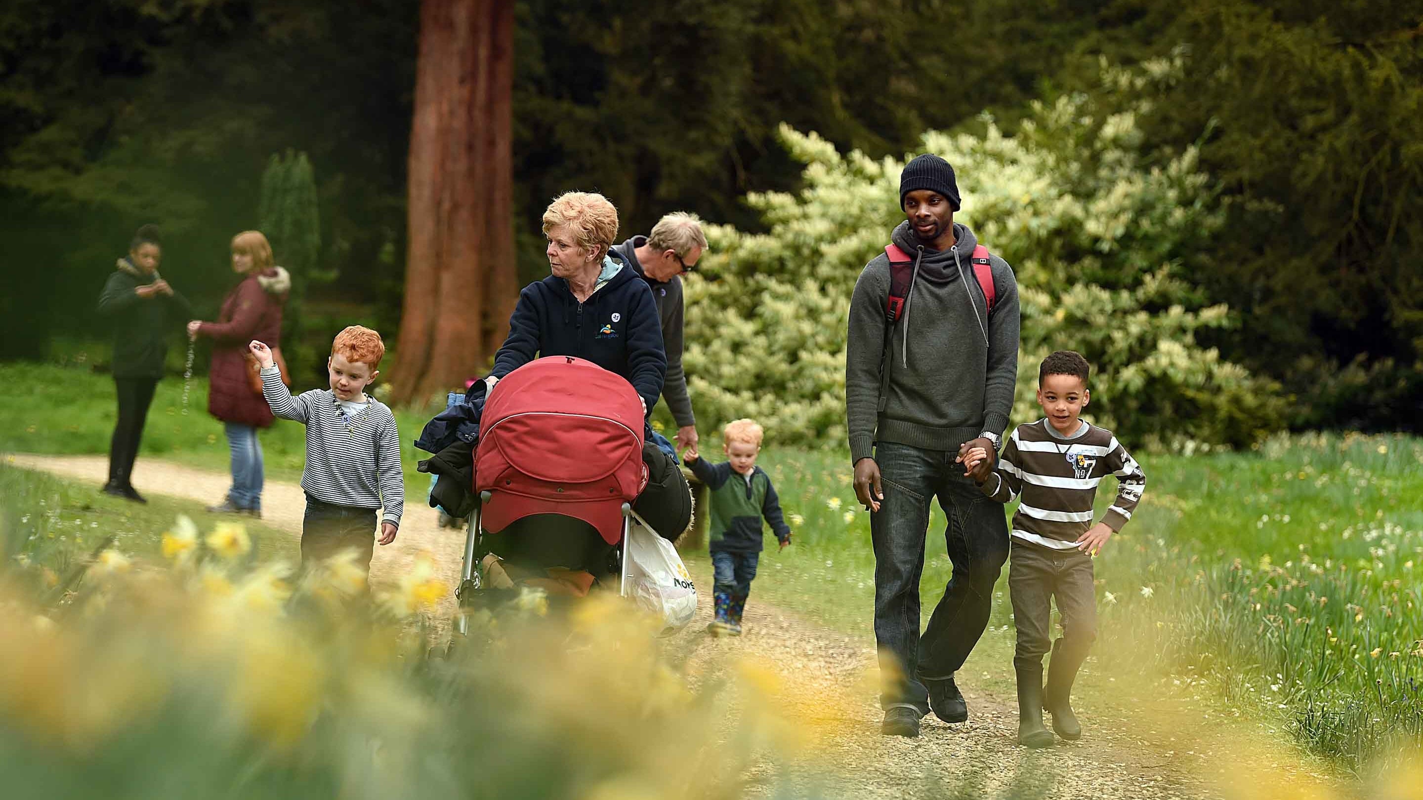 Visitors in the garden in spring at Belton House, Lincolnshire