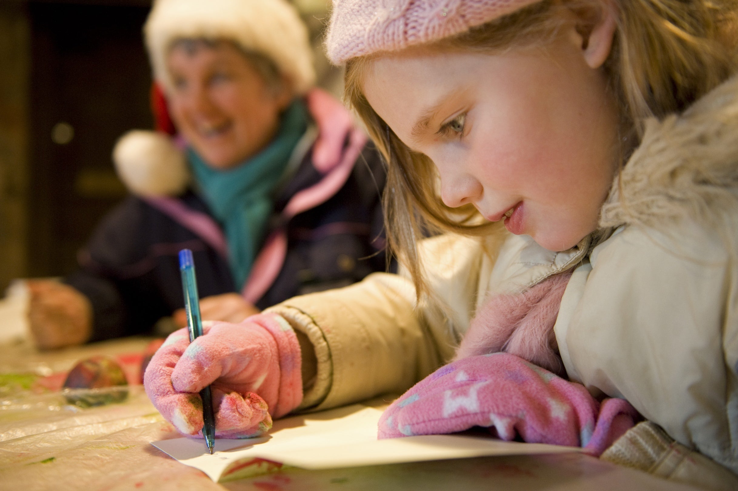 Child making Christmas cards