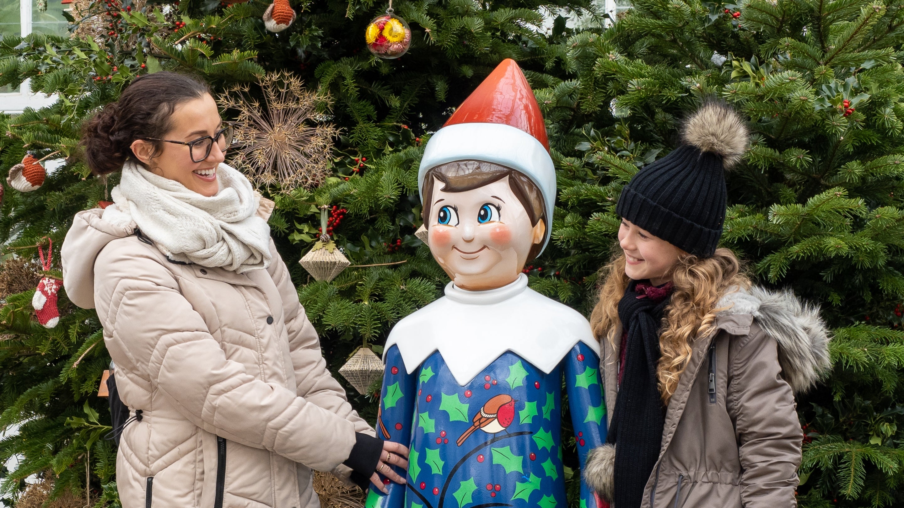 Visitors enjoying The Elf on the Shelf sculpture trail