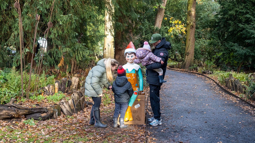 Family enjoying The Elf on the Shelf Sculpture Trail