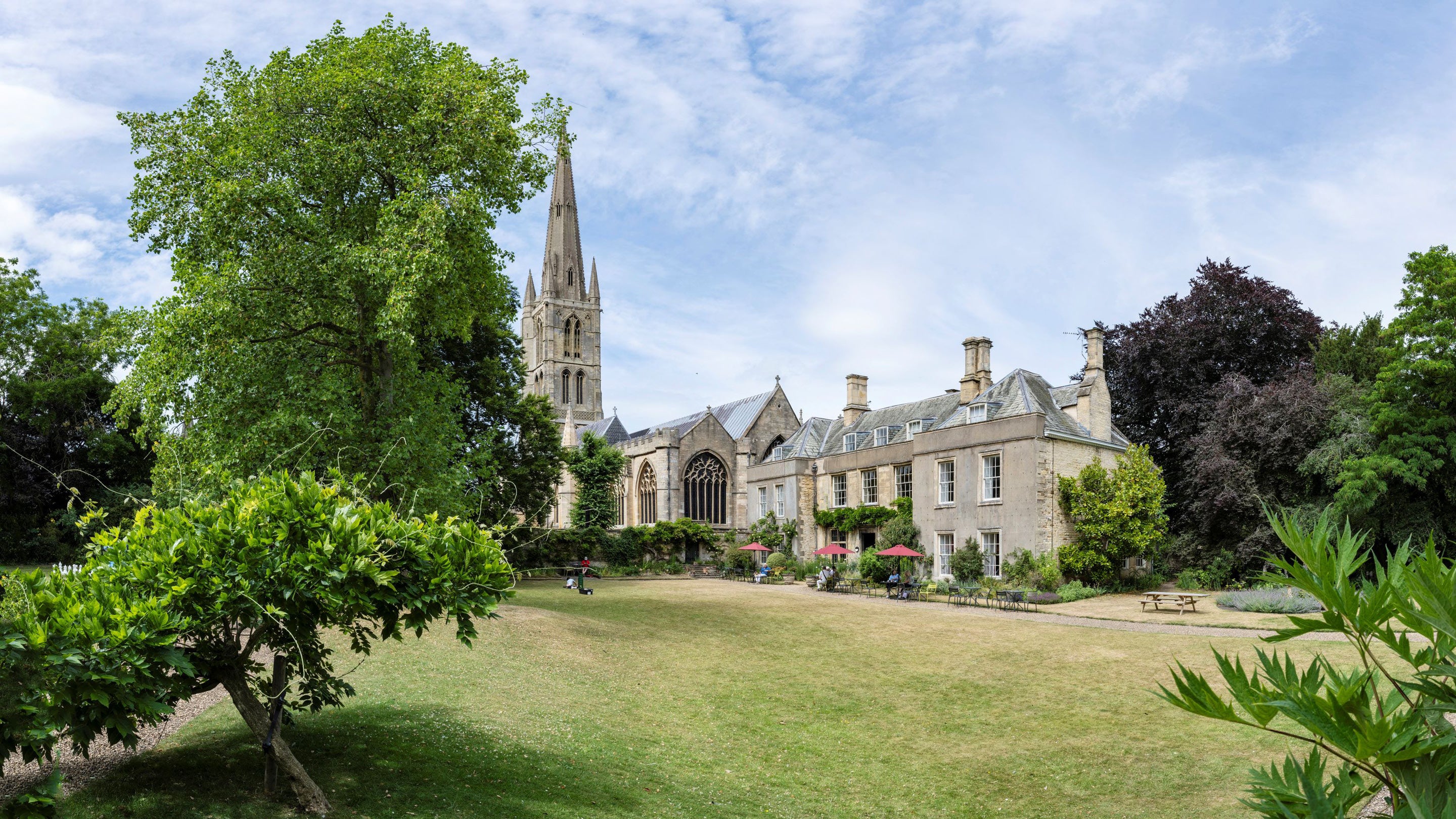 Grantham House and St Wulfram's Church seen from the lawns in summer.