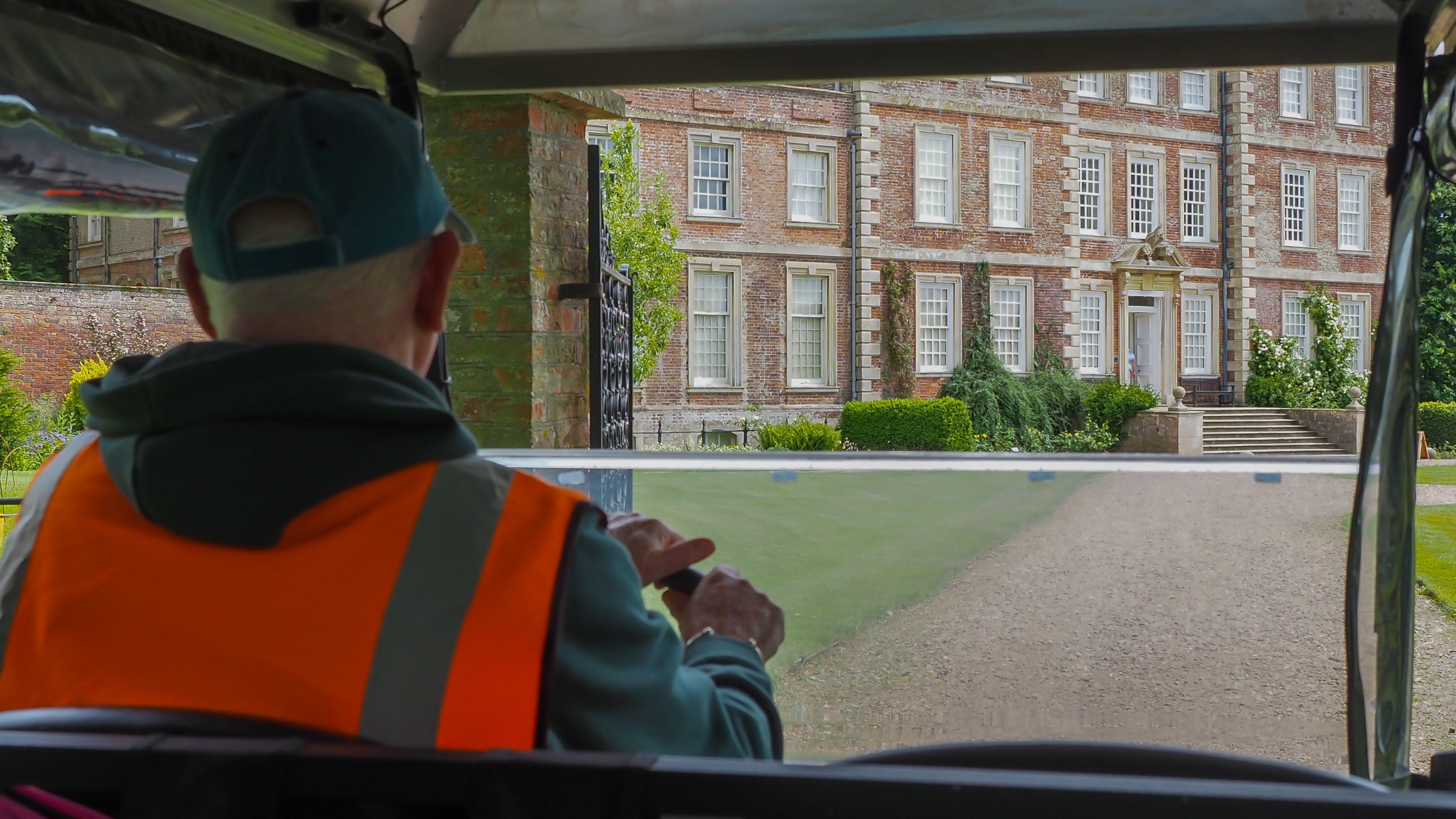 A volunteer shuttle driver approaching Gunby Hall.
