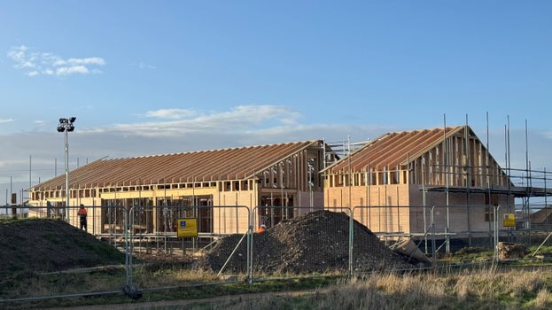 Timber-framed structure of the new café building at Sandilands under construction, with roof framework in place.