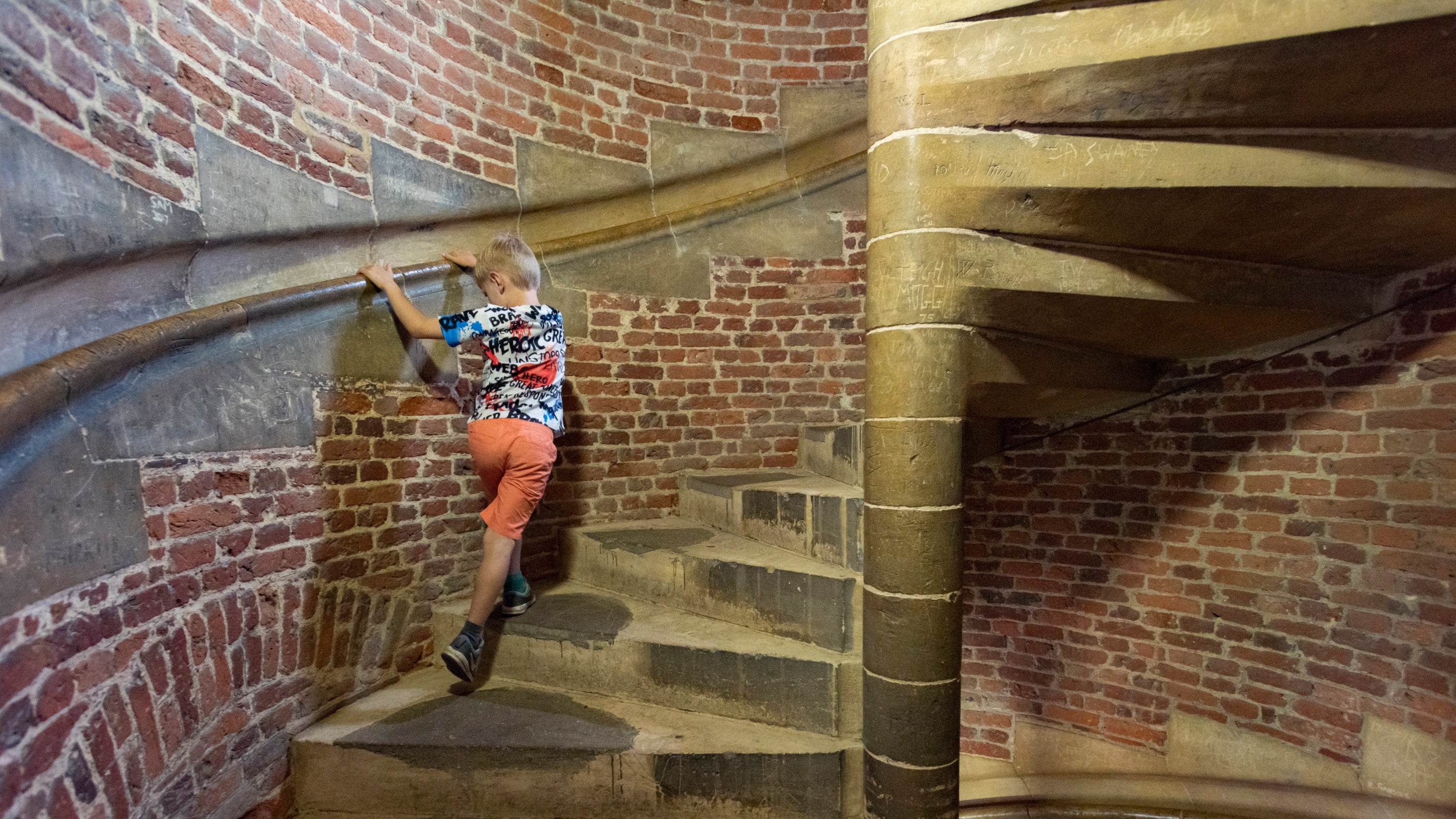 A boy on the spiral stairwell at Tattershall Castle, Lincolnshire